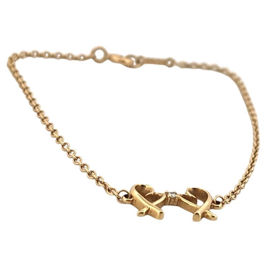 Or jaune 18K Tiffany & Co. Paloma Picasso - Bracelet à double cœur d'amour Pour femmes en vente
