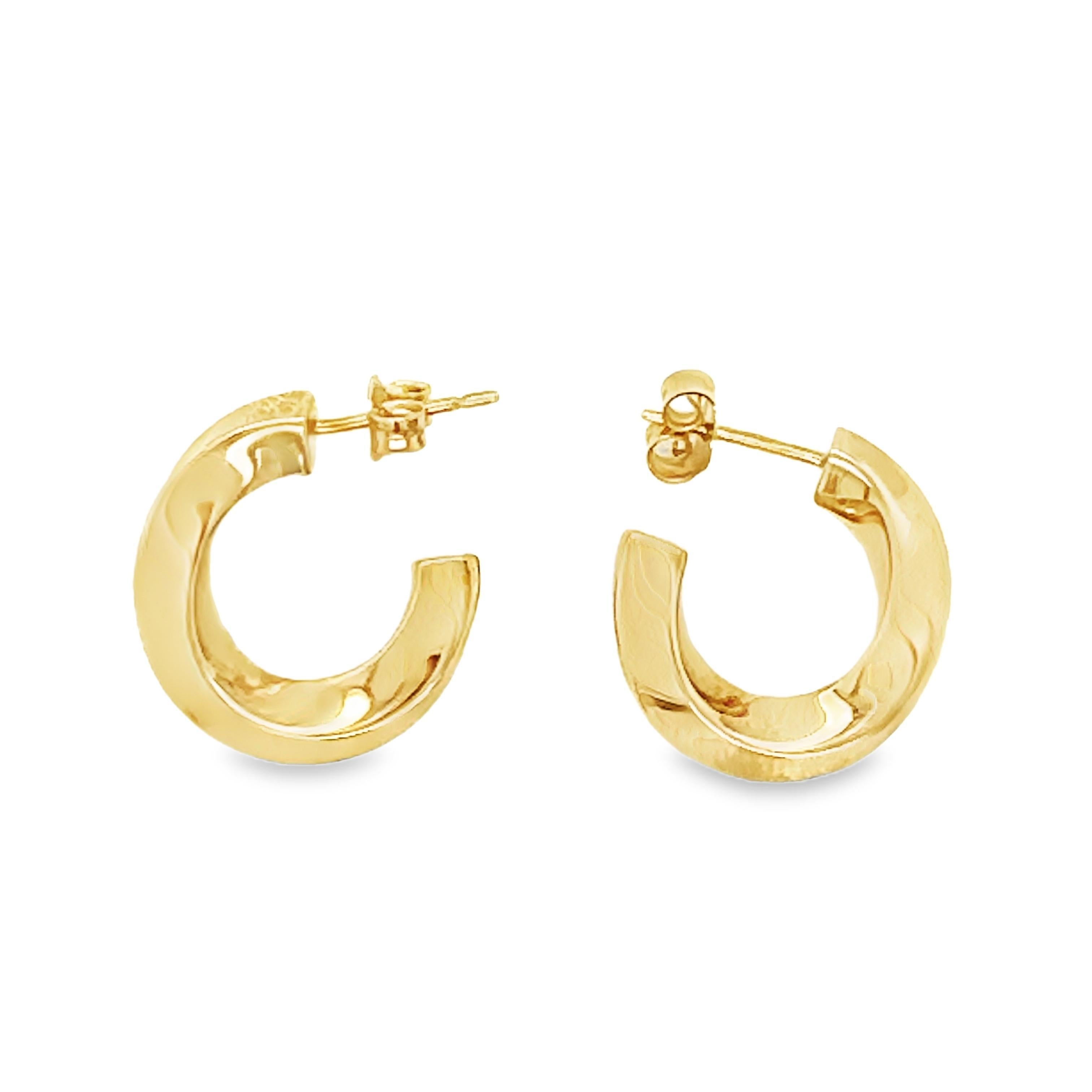 These elegant 18K yellow gold twist hoop earrings by Tiffany & Co. showcase the brand's signature blend of timeless style and exceptional craftsmanship. Measuring 20 mm in diameter and 4 mm wide, the delicate twist design adds texture and