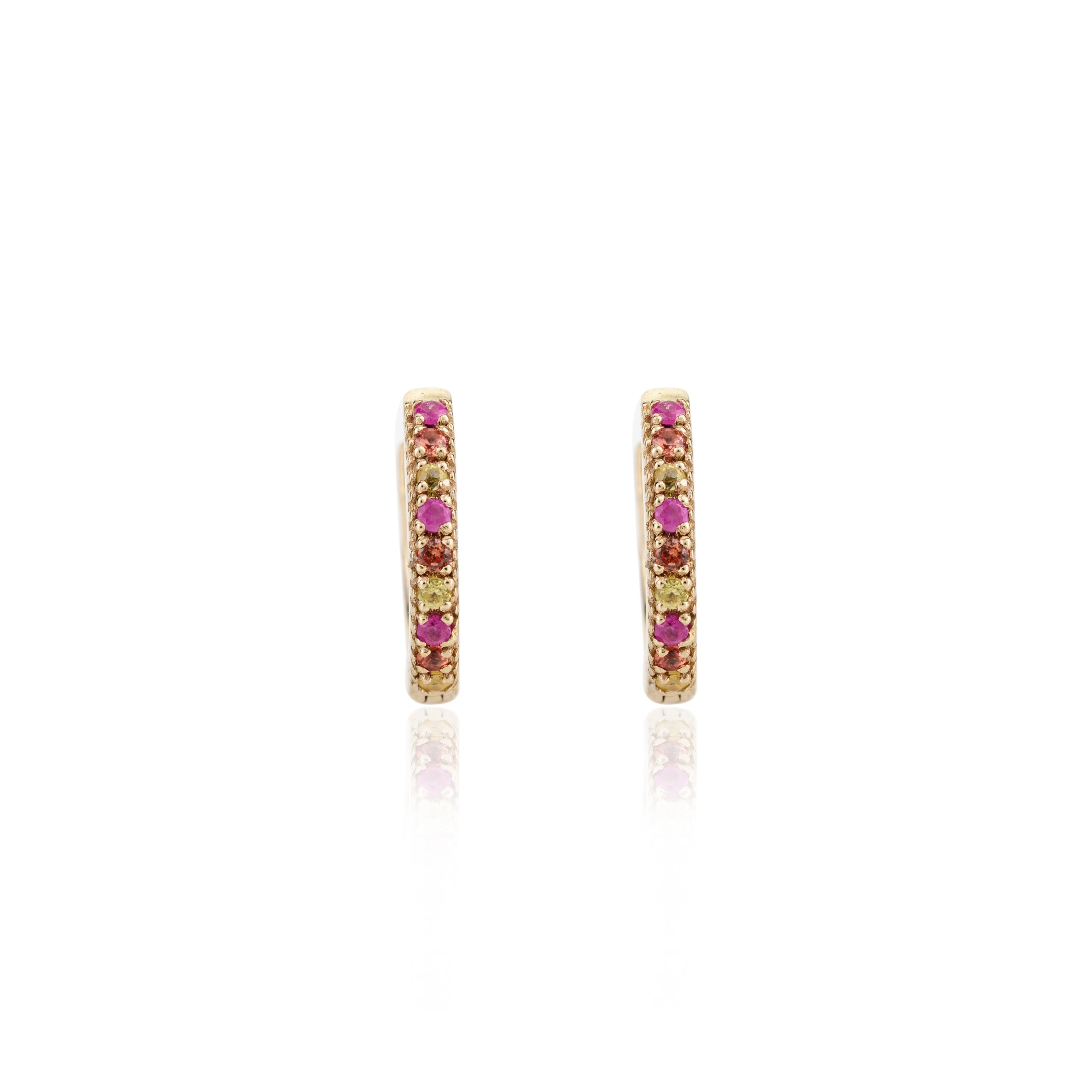 Tiny Multi Sapphire Everyday Huggie Hoop Earrings in 18K Gold to make a statement with your look. You shall need stud earrings to make a statement with your look. These earrings create a sparkling, luxurious look featuring round cut multi