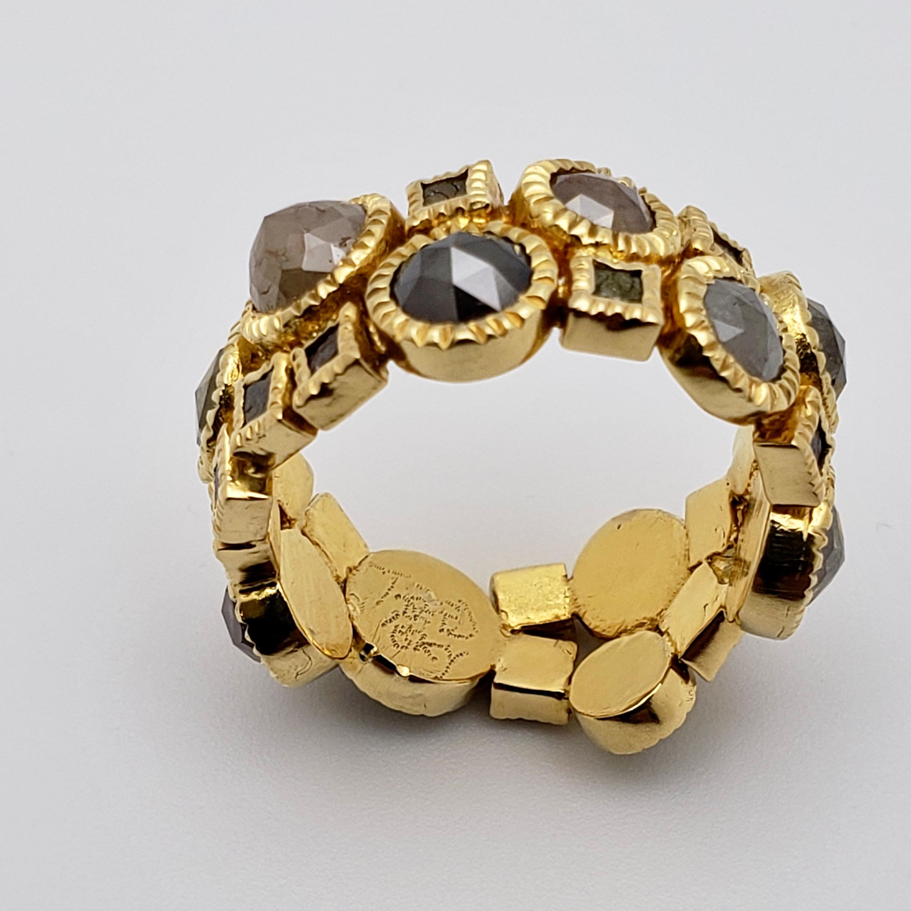An original 18K yellow gold diamond eternity band. Mounted with numerous natural Roughcut color diamonds, signed Todd Reed. Mounted with 11 dome-faceted round shaped natural colored diamonds (grayish, pinkish, greenish, ect.) and 15 smaller rough