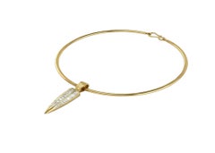 18k Yellow Gold Toruqe Necklace with a baguette diamond drop pendant