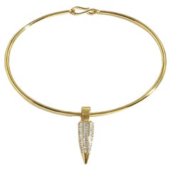 18k Yellow Gold Toruqe Necklace with a baguette diamond drop pendant