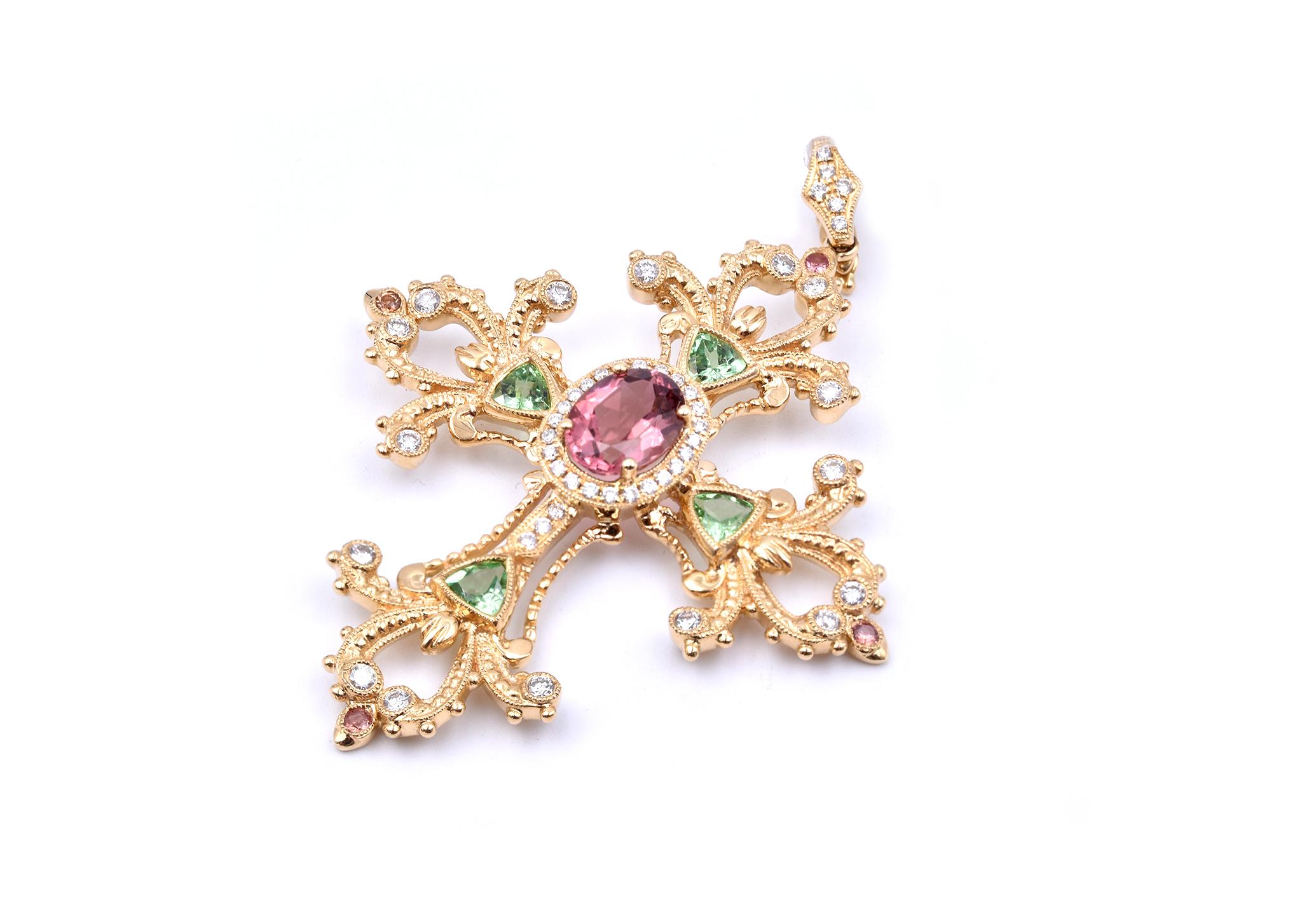 Designer: custom
Material: 18k yellow gold
Tourmaline:  1 oval cut and 4 round cut pink tourmaline, 4 trillion cut green tourmalines = 1.97cttw
Diamonds: 49 round brilliant cuts = 0.65cttw
Dimensions: pendant measures 61.95mm x 45.50mm 
Weight: