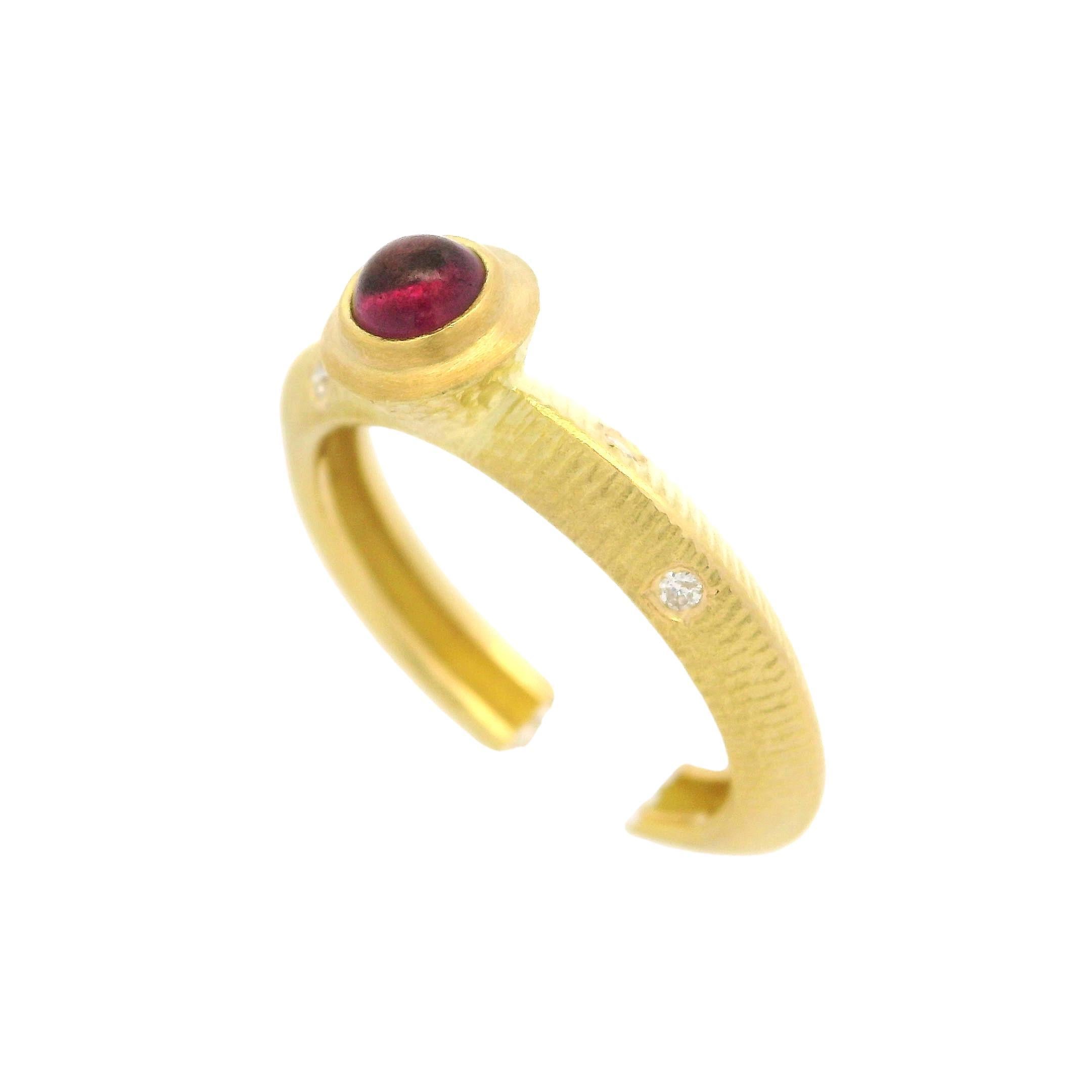 –Stone(s)–
(1) Natural Genuine Tourmaline - Round Cabochon - Bezel Set - Pink Color - 3.57mm (approx.)
(4) Natural Genuine Diamond - Round Brilliant - Burnished Set - White Color - VS2-SI1 Clarity - 0.04ctw (approx.)

Material: Solid 18k Yellow