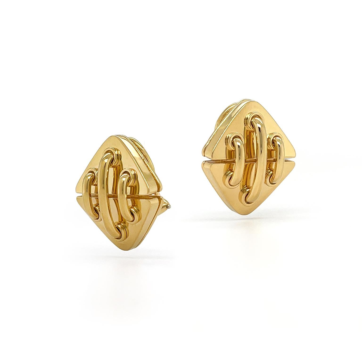 The earrings showcase the luminous 18k yellow gold in a design inspired by stitchwork. A pair of parallel triangles is the fabric, while three golden threads connect to the triangles. The polishing across the precious metal reflects the light to