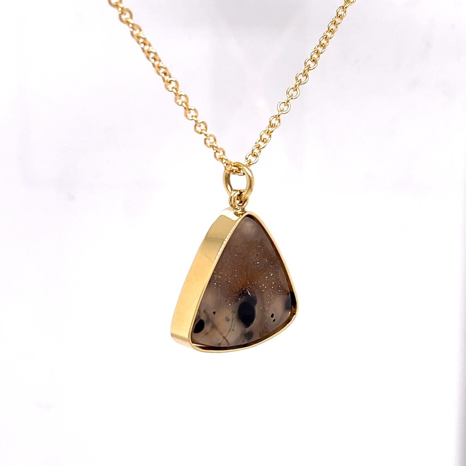 A 13.95 carat trillion shaped druzy necklace set in 18k yellow gold, on a 14k yellow gold 18 inch 2mm cable chain. This necklace was made and designed by llyn strong.