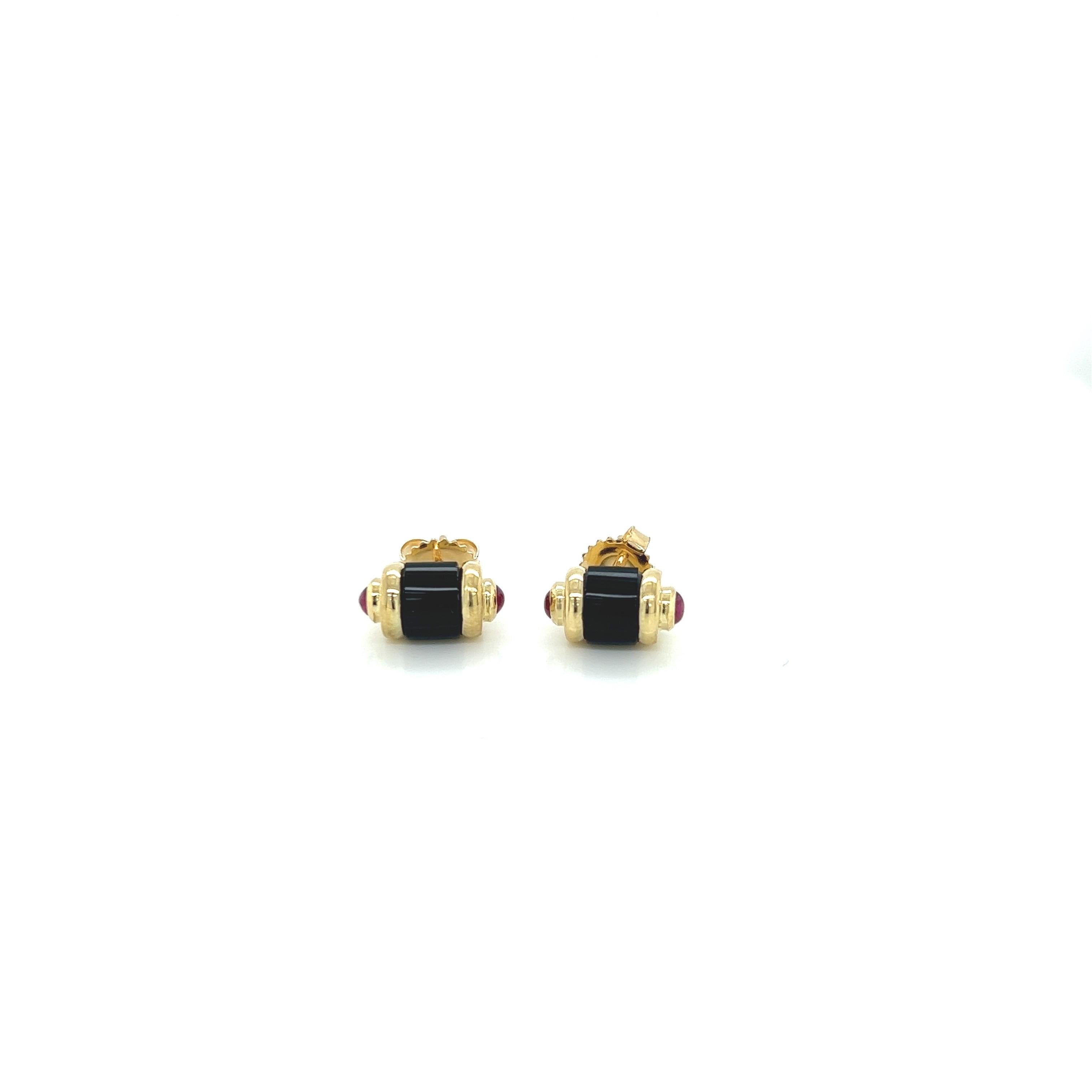 18k Yellow Gold Art Deco Tubular Design Stud Earrings With Hand Cut Black Onyx and Cabochon Rubies On The Sides.
Comes with 18k gold earring backs.

Measures approximately 7mm x 12.5mm