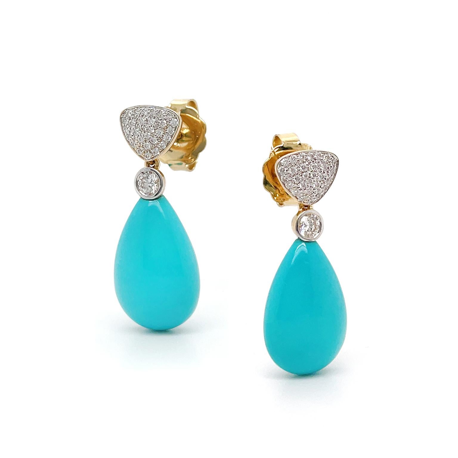 Dazzling diamonds spotlight turquoise in these 18k yellow gold drop earrings. Pave-set brilliant cut diamonds in a downturned triangular shape begin the design. A smooth teardrop turquoise with a bezel-set diamond atop follows. The total weight is