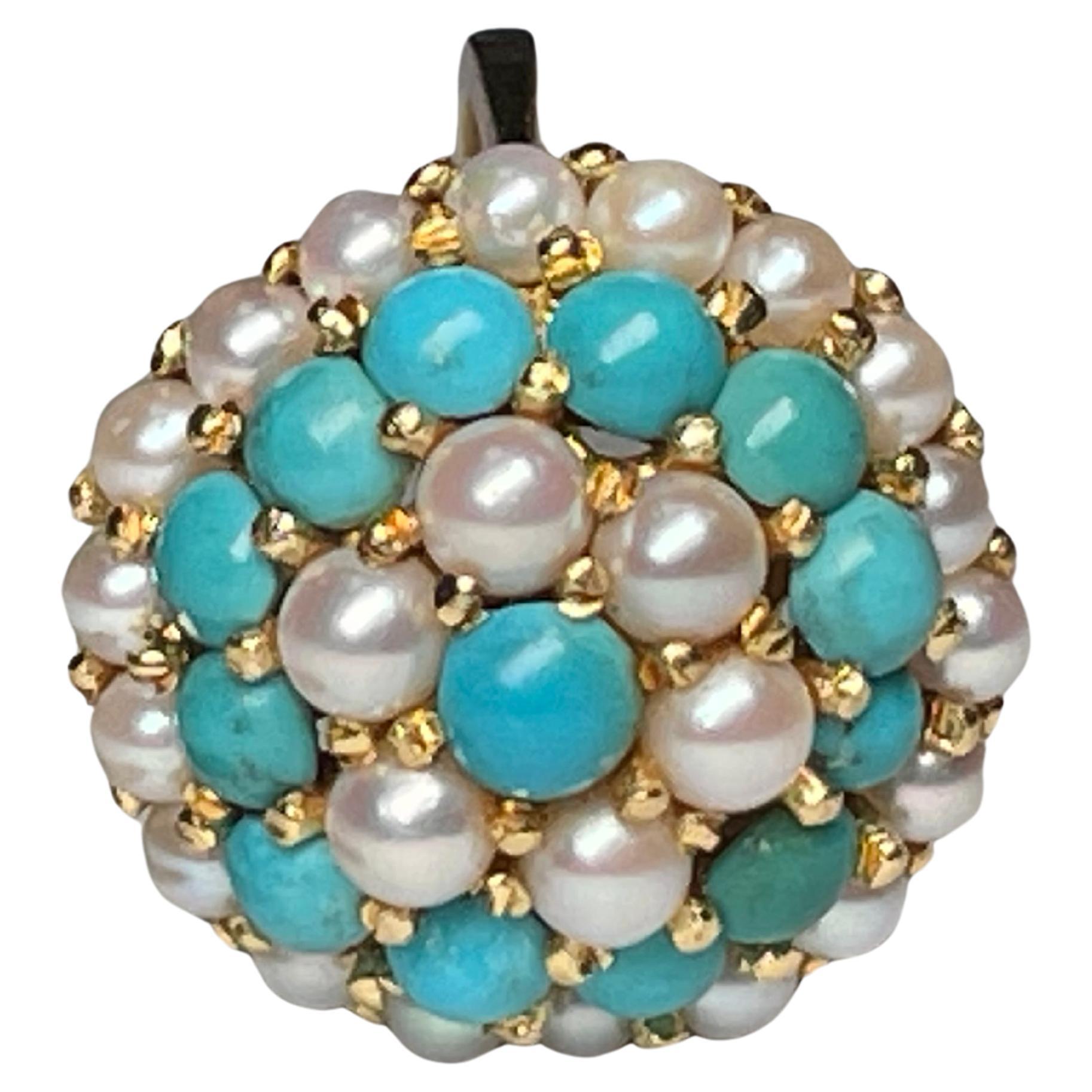 This is an 18K yellow gold Pearls and Turquoises dome cocktail ring. Its weight is 9.9 grams. There is a halo of eighteen small round pearls ( 3.4mm ) in prong setting arranged at the base followed by another halo of twelve small turquoise