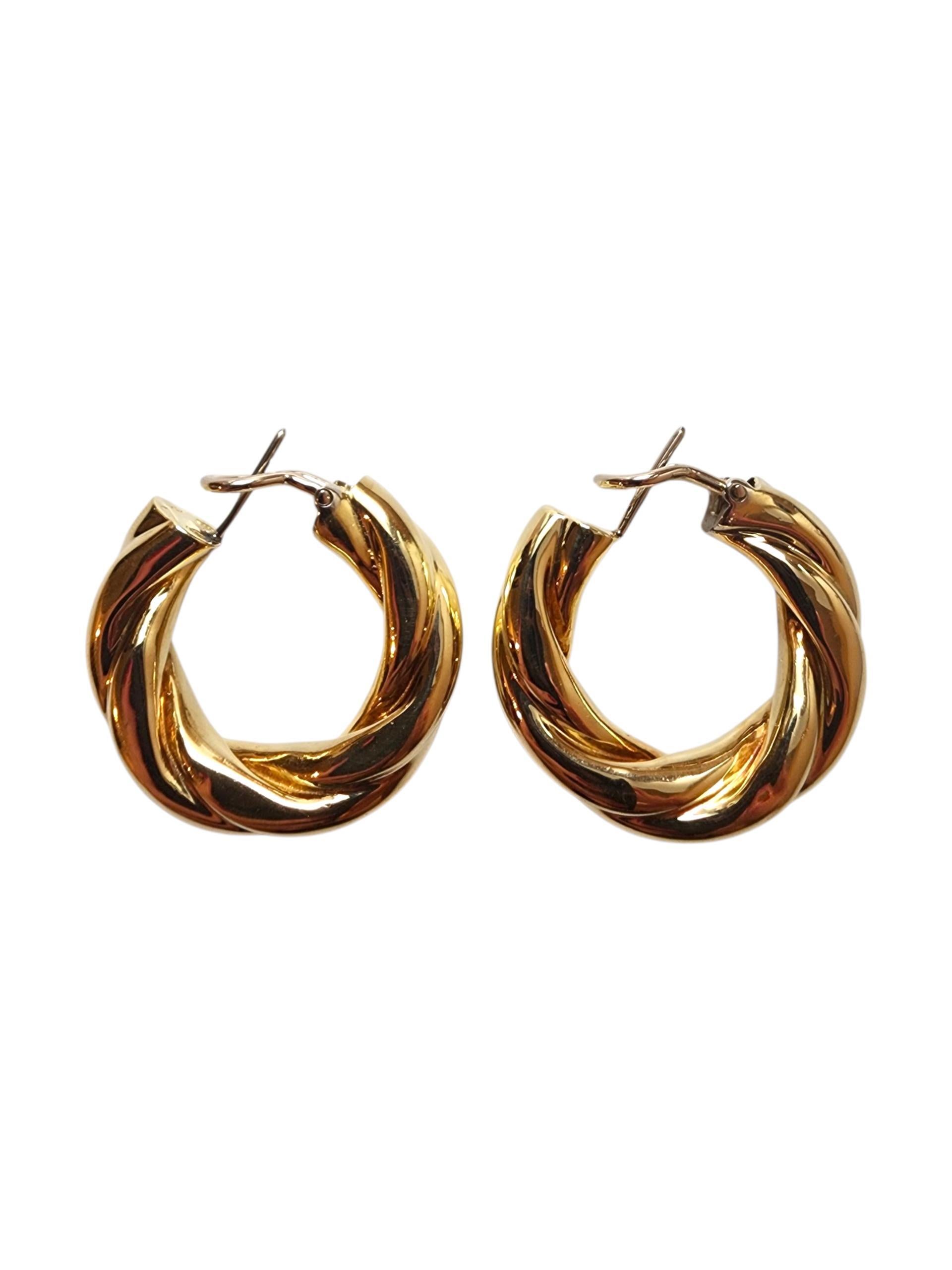 18K Yellow Gold Twisted Hoop Earrings -

These 18K yellow gold twisted hoop earrings feature a graceful, rope-inspired design that adds texture and movement to a classic shape. With their warm golden hue and elegant twist, they offer a timeless yet