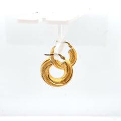 Orecchini a cerchio ritorto in oro giallo 18K