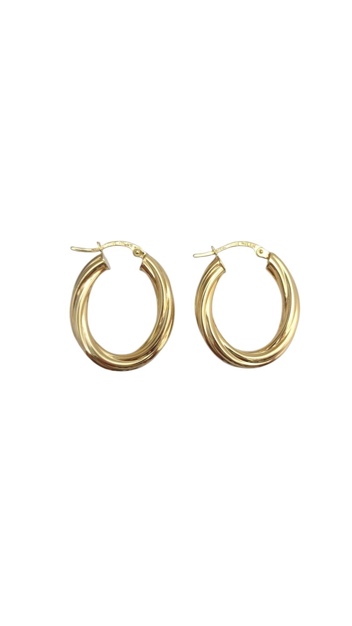 18K Yellow Gold Twisted Oval Hoop Earrings 

These stunning 18k yellow gold twisted oval hoop earrings feature a unique, intricate design that adds a touch of sophistication and texture to any look. The elegant twist gives them a refined, modern