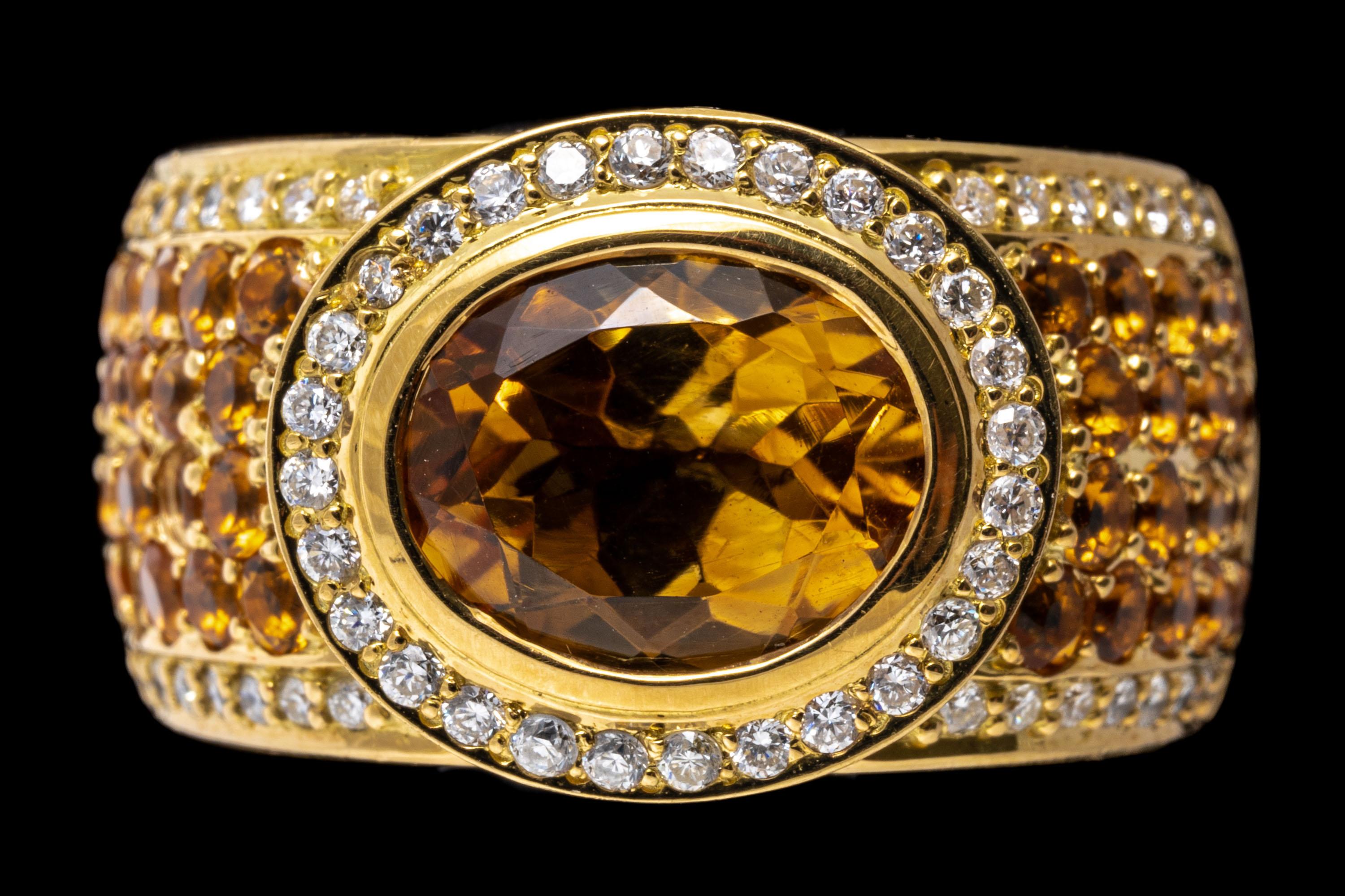 18k yellow gold ring. This gorgeous ultra wide ring is set with a center horizontal oval faceted, medium yellow orange color citrine, approximately 2.13 CT, and framed by a round faceted diamond halo. The wide shank is pave set with round faceted