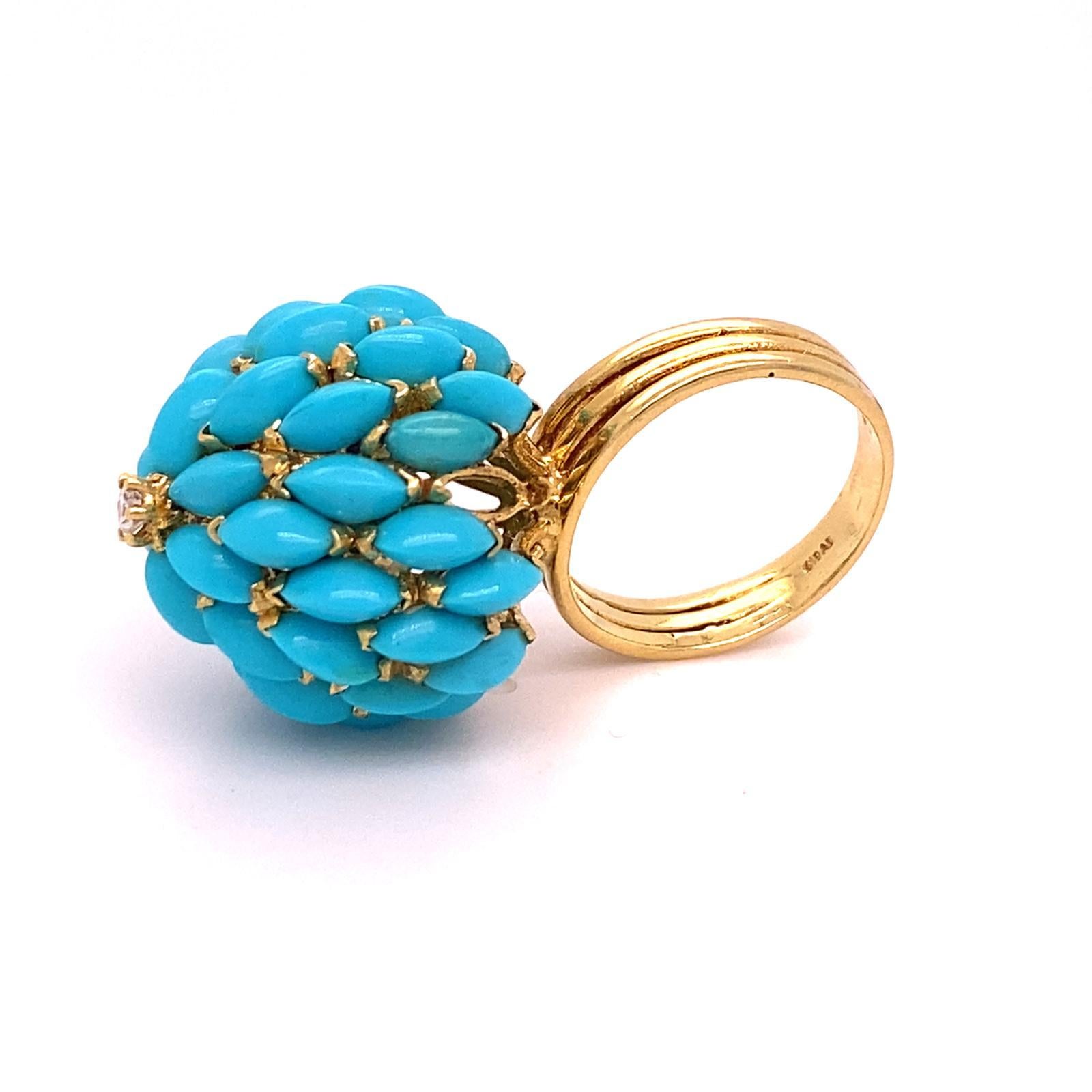 Gorgeous, Unique Bombe Ring
Features Marquise-Cabochon Shaped Turquoise Arranged in Cascading Pattern in 18k Yellow Gold
Single 0.08 ct Diamond at Tip
Size 6.75
Total Mass = 12.1 grams
Piece is Overall in Good Condition. One Turquoise is Missing. A