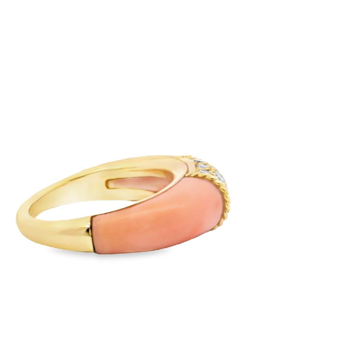 This elegant and timeless Van Cleef & Arpels “Philippine” ring, crafted in 18K yellow gold, showcases a refined design that seamlessly blends luxury with sophistication. The centerpiece features a cluster of round white diamonds, totaling 0.25