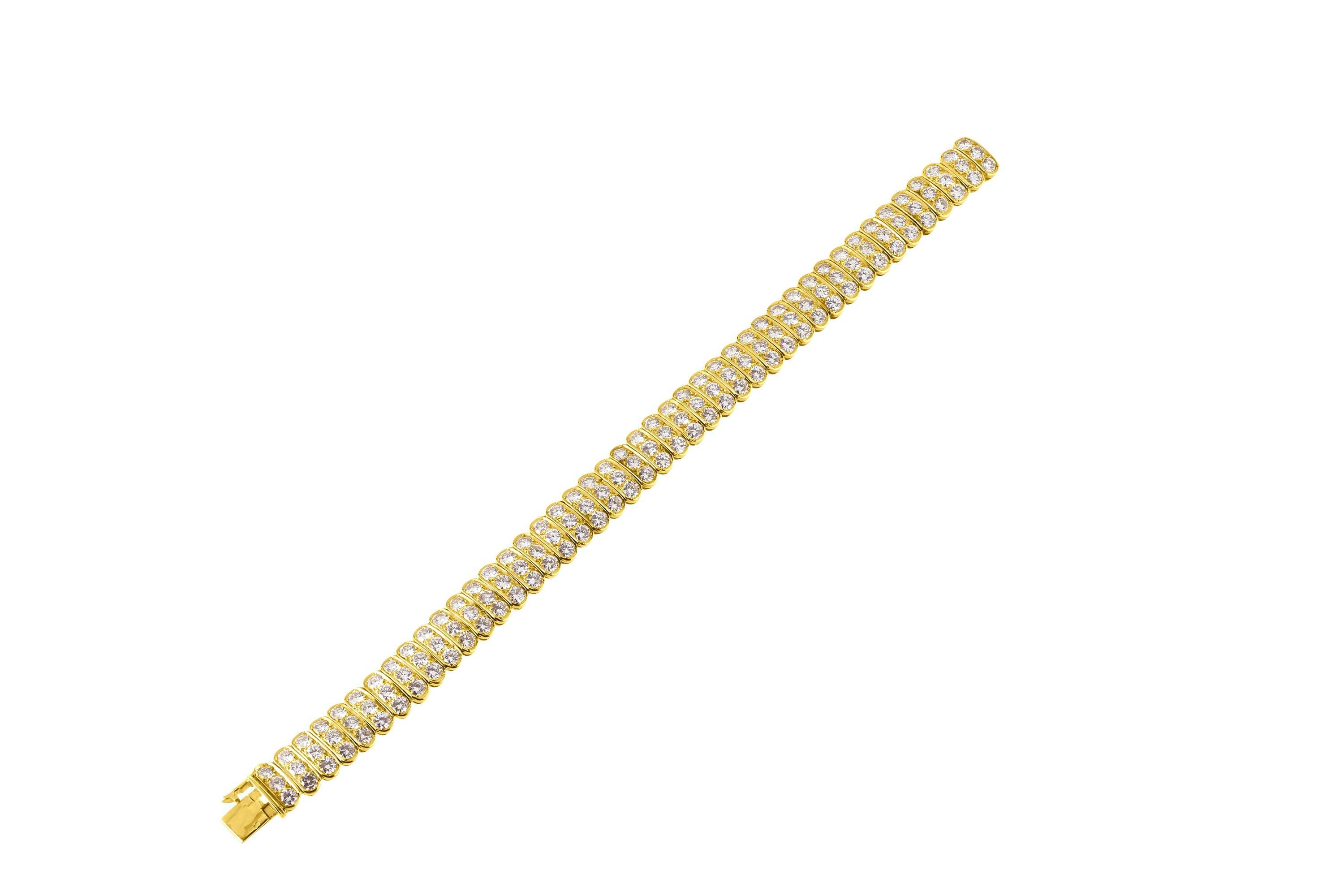 This Van Cleef & Arpels Bracelet features 13.23 carats of round brilliant diamonds D-F colors VVS clarity set in 18K yellow gold. 7 Inches long. Article No. 30787. Signed Van Cleef & Arpels 30787. 