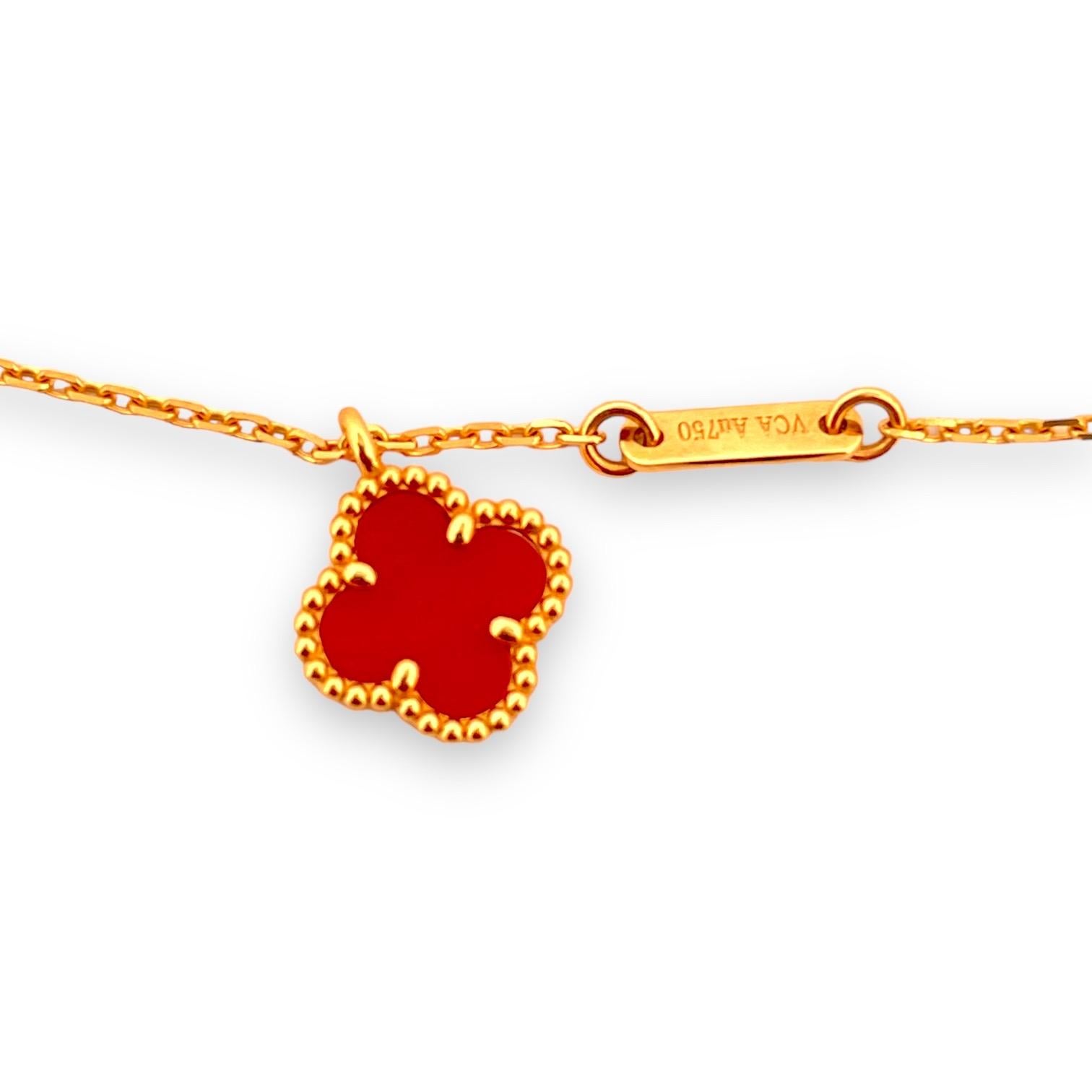 Embrace the symbol of luck and luxury with our 'Golden Charm' pendant, an exquisite piece from Van Cleef & Arpels' Sweet Alhambra collection. Meticulously crafted in 18k yellow gold, this pendant features a rich carnelian clover that exudes warmth