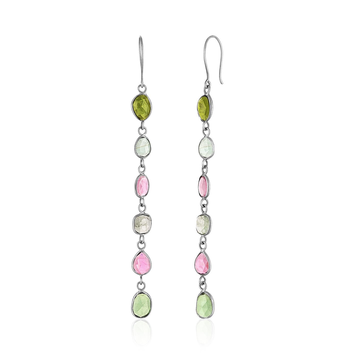 Tourmaline is the most prized of the semiprecious stones and this watermelon tourmaline is shown in stones from rose to raspberry, from moss to fern. The rose cut reflects on natural light with brilliance and strong settings maintain its quality and