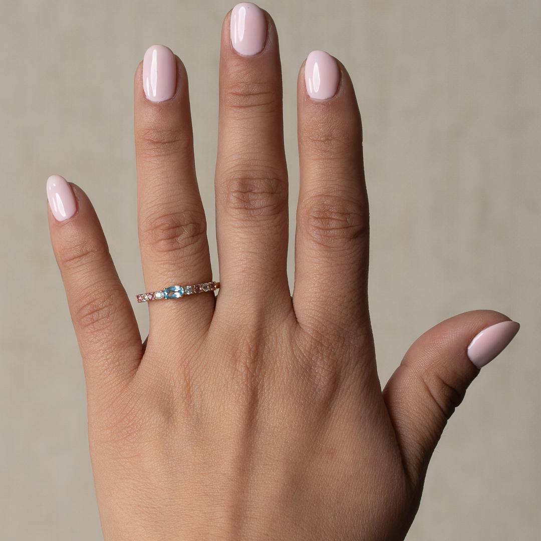 This pastel pink and pastel blue gemstone ring evokes femininity. An eye-catching design made from a mixture of round and oval gemstones. Playful, fun, but still a standout. Wear it alone, or as the final piece to stackable rings. Ring features Pink