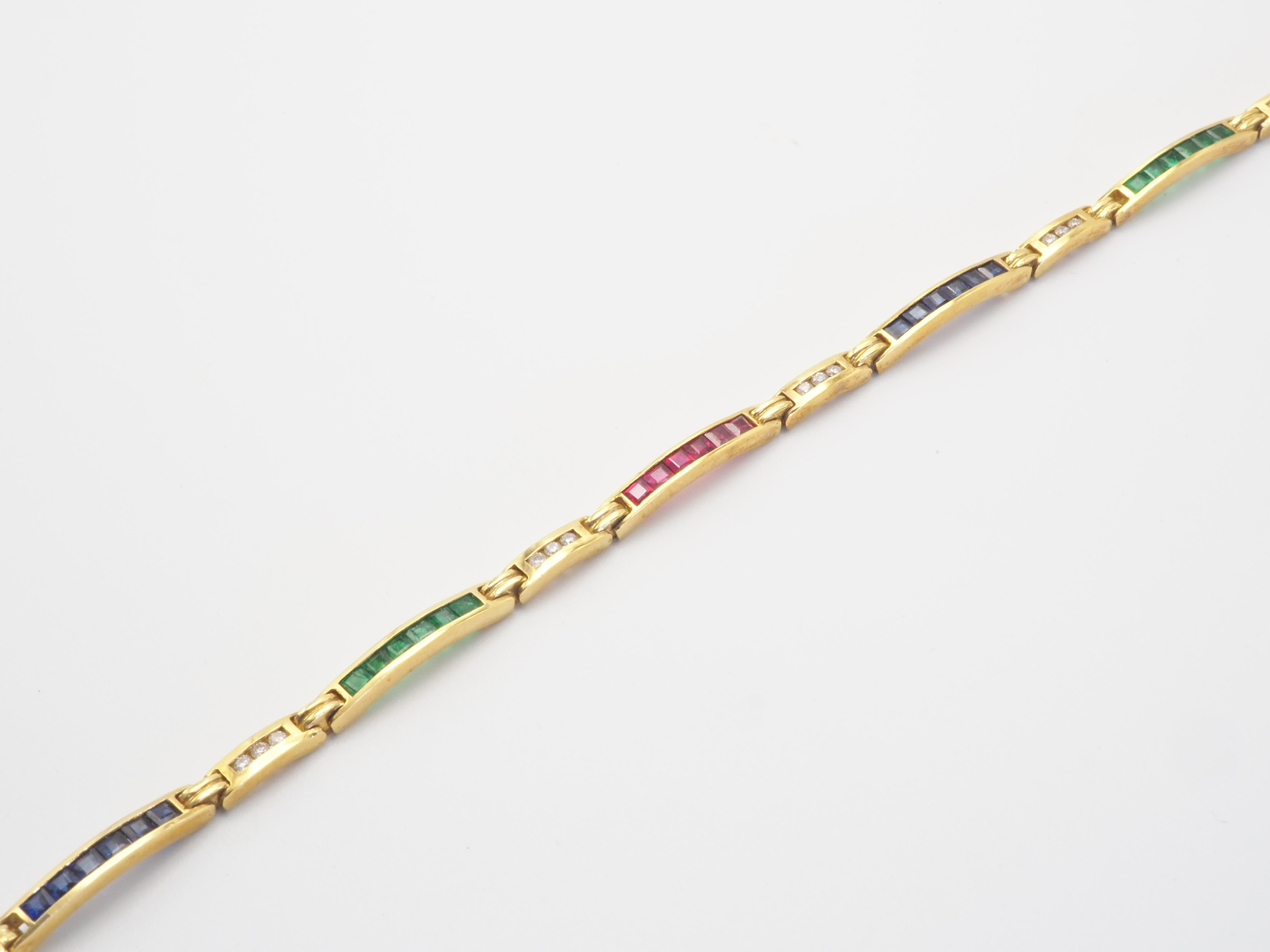 A very beautiful handmade bracelet in 18K solid yellow gold with multiple square cut precious stones which includes rubies, sapphires and emeralds weighting a total of 2.30 carats. The bracelet also includes gorgeous VS grade diamonds of total 18