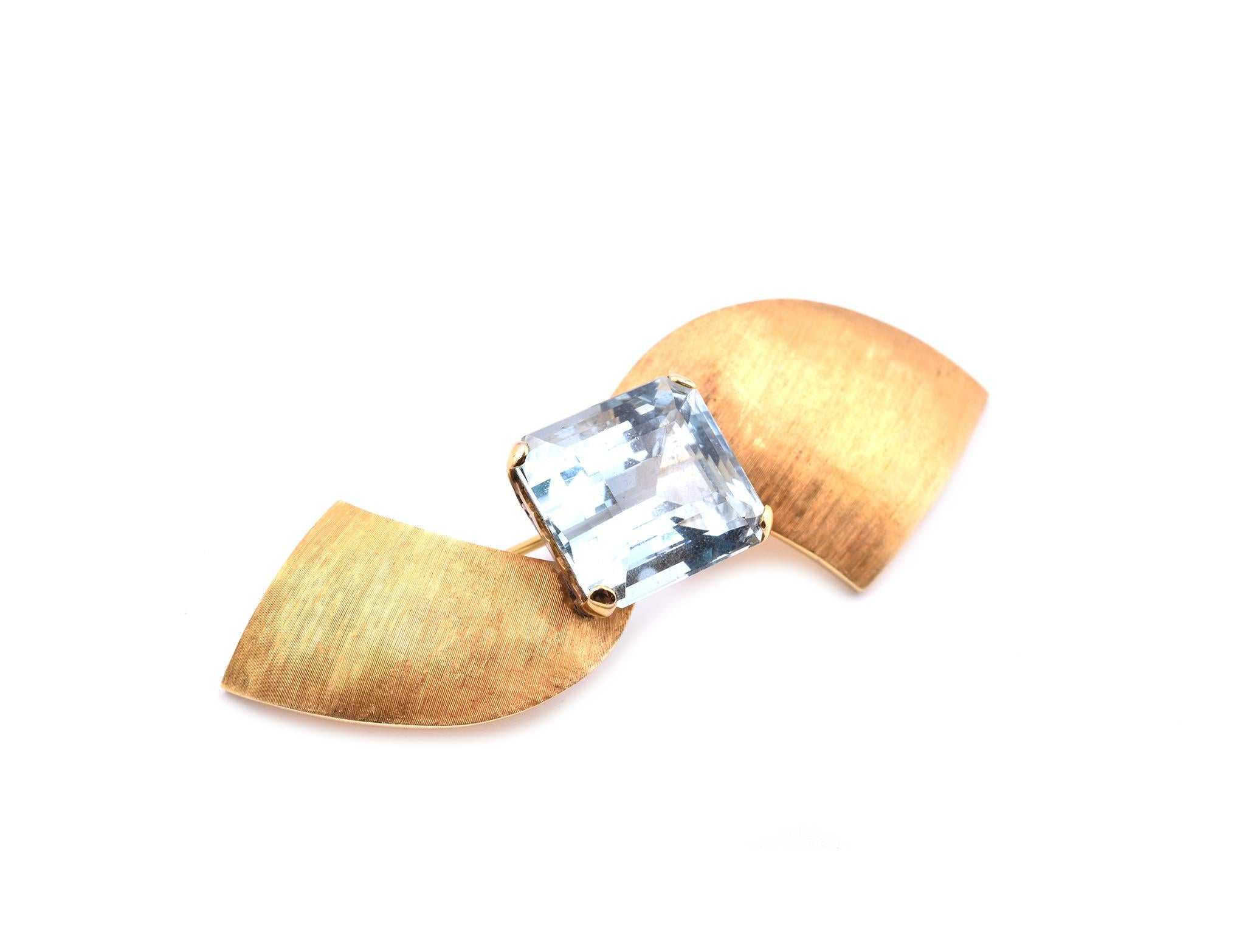 Designer: custom designed
Material: 18k yellow gold
Aquamarine: 1 emerald cut= 15.50ct
Dimensions: pin is 2 ½-iches long and it is 24mm wide
Weight: 11.93 grams
