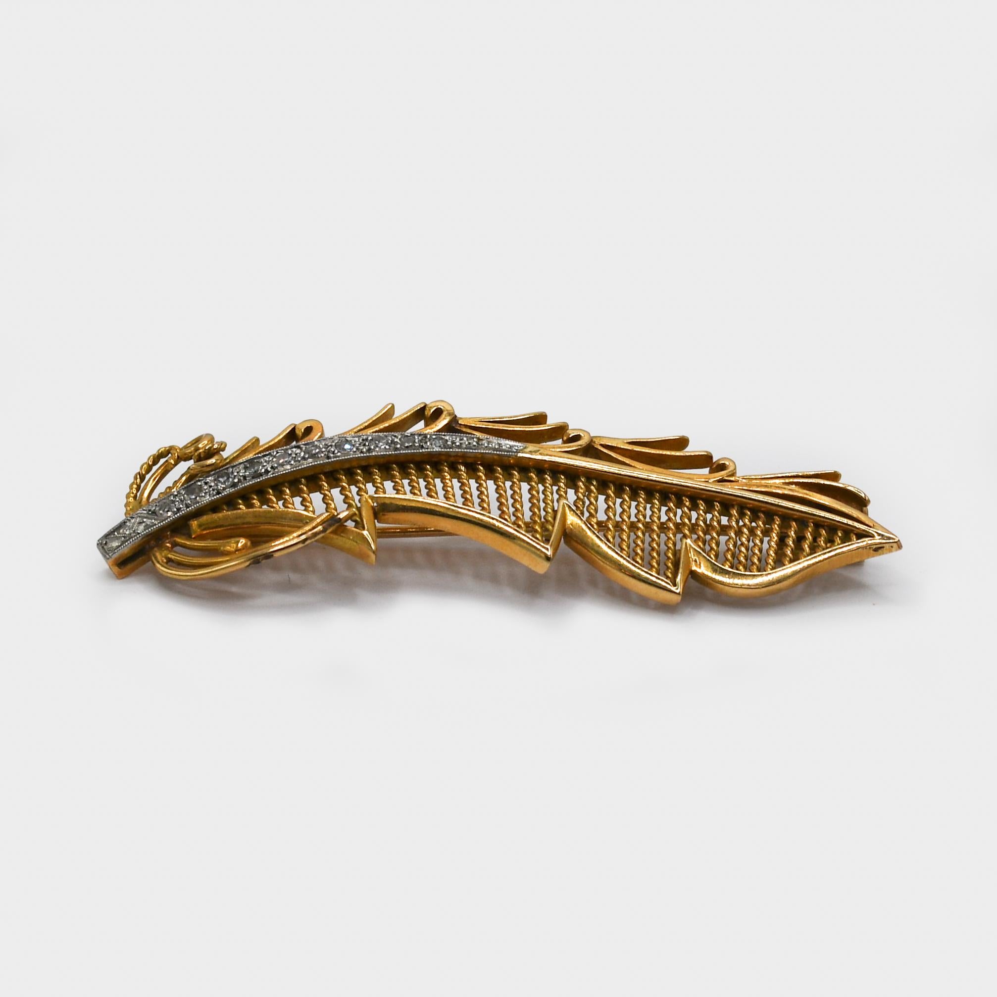 18K Yellow Gold Vintage Diamond Brooch 15.6gr
18k yellow gold vintage diamond brooch. 
The brooch is a leaf design, set with a row of small single cut diamonds.
0.15tdw.
Weighs 15.6gr, not stamped but tests strong 18k 
2 1/2