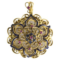 Broche vintage de oro amarillo de 18 quilates con rubí y zafiro