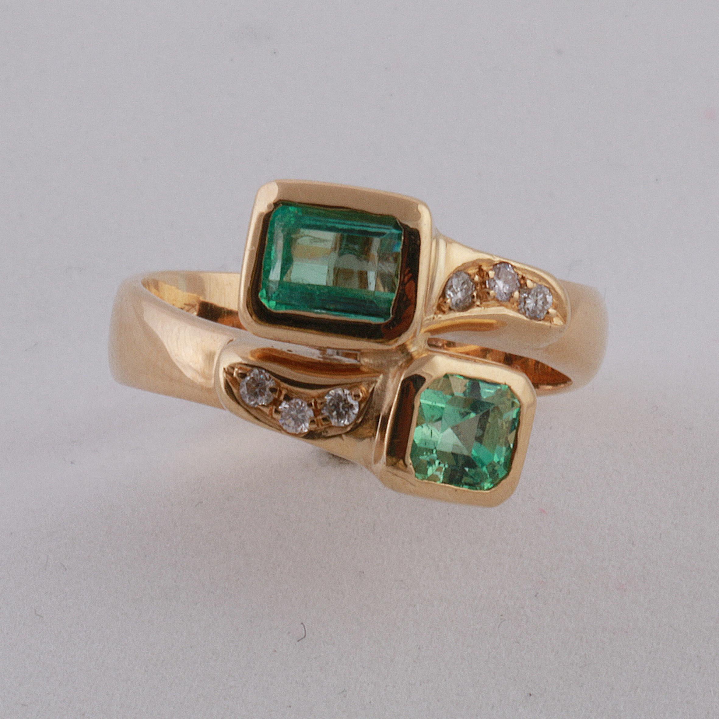 18K Yellow Gold Ring with two Emeralds (1 rectangular cut 0.70cts and 1 square cut 0.50cts), matching color, transparent light green,  and six Diamonds (brilliant round cut 0.12cts). Made in Italy. 750 stamp. 1990's. Size EU: 58 Us:18.