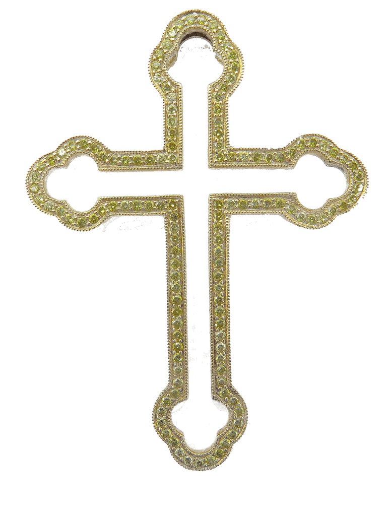 This elegant, multi-style pendant is very unique in that it can be worn in three different ways, as shown in the accompanying pictures. A beautiful 18k Yellow Gold frame of a Celtic Cross is studded with round, sparkling white diamonds. Perfectly