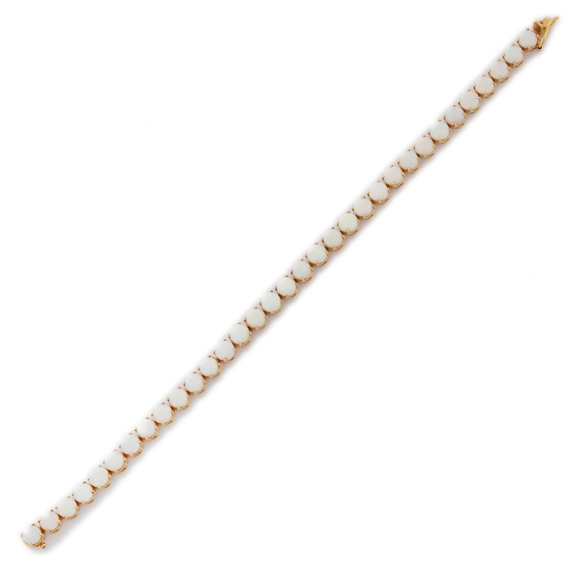 This Round Cut White Opal Tennis Bracelet in 18K gold showcases 33 endlessly sparkling natural opal, weighing 10.1 carats. It measures 7.25 inches long in length. 
Opal enhances creativity, passion and strength.
Designed with perfect round cut opal