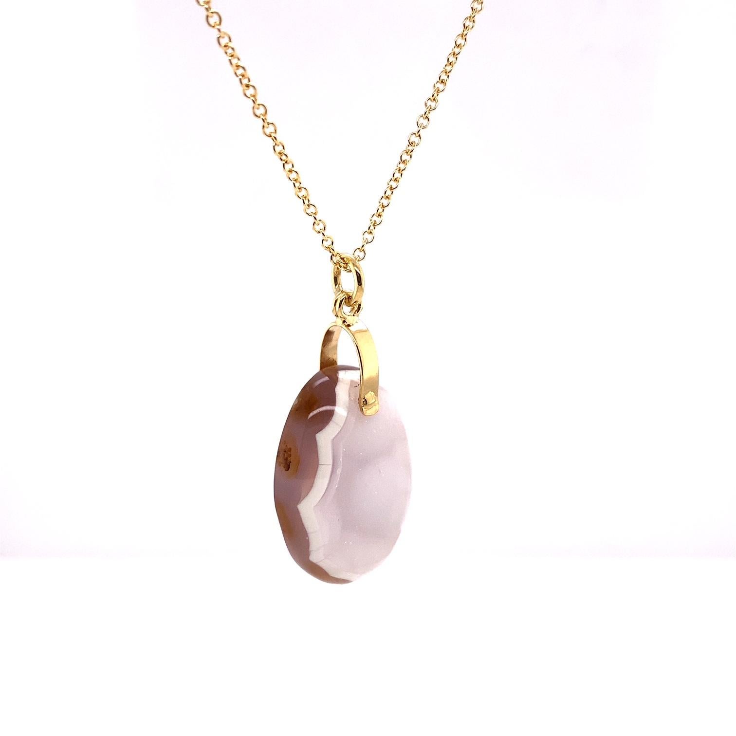 An 18k yellow gold oval white druzy pendant on a 14k yellow gold 1.5mm 18 inch cable chain. This necklace was made and designed by llyn strong.