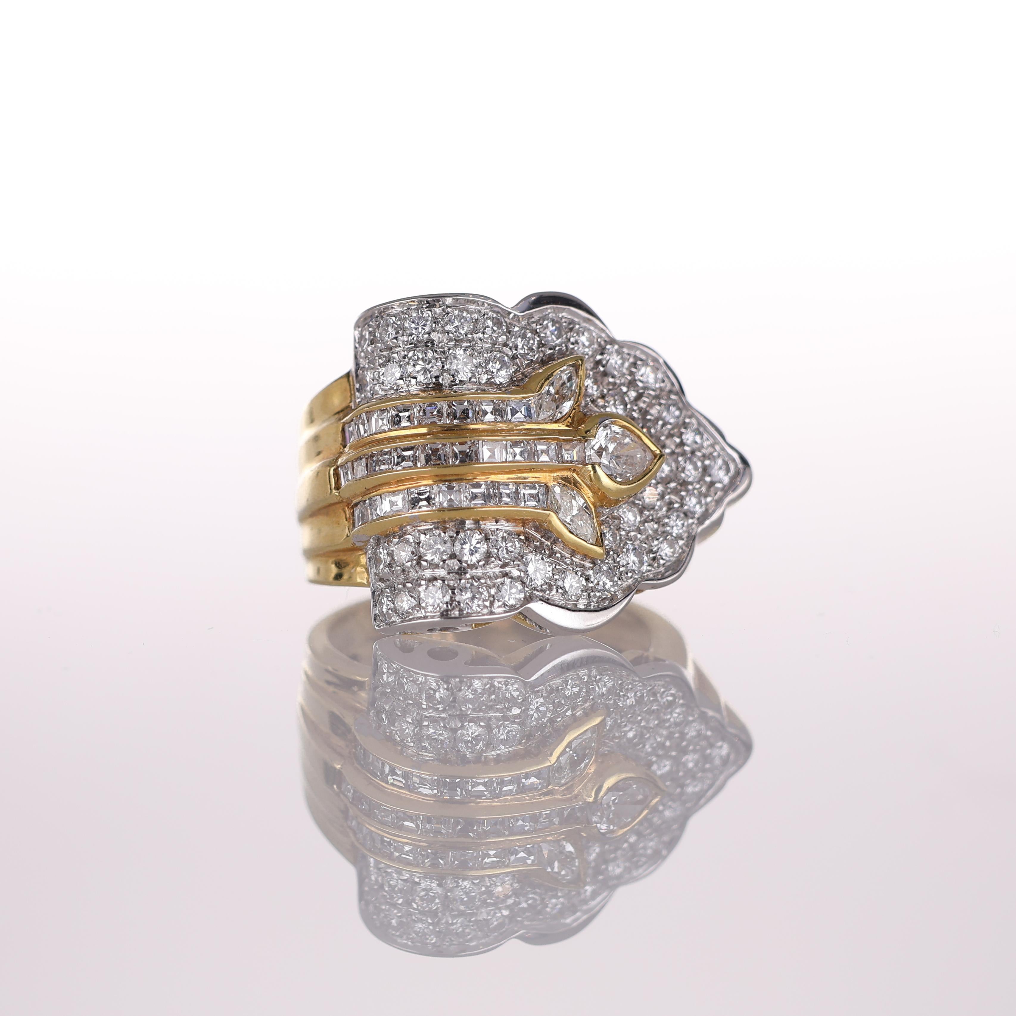 A striking wide band ring in 18K yellow gold, featuring an intricate leaf-inspired design adorned with 1.96 carats of brilliant-cut diamonds. The elegant contrast between the sculptural gold details and the shimmering pavé diamonds enhances the