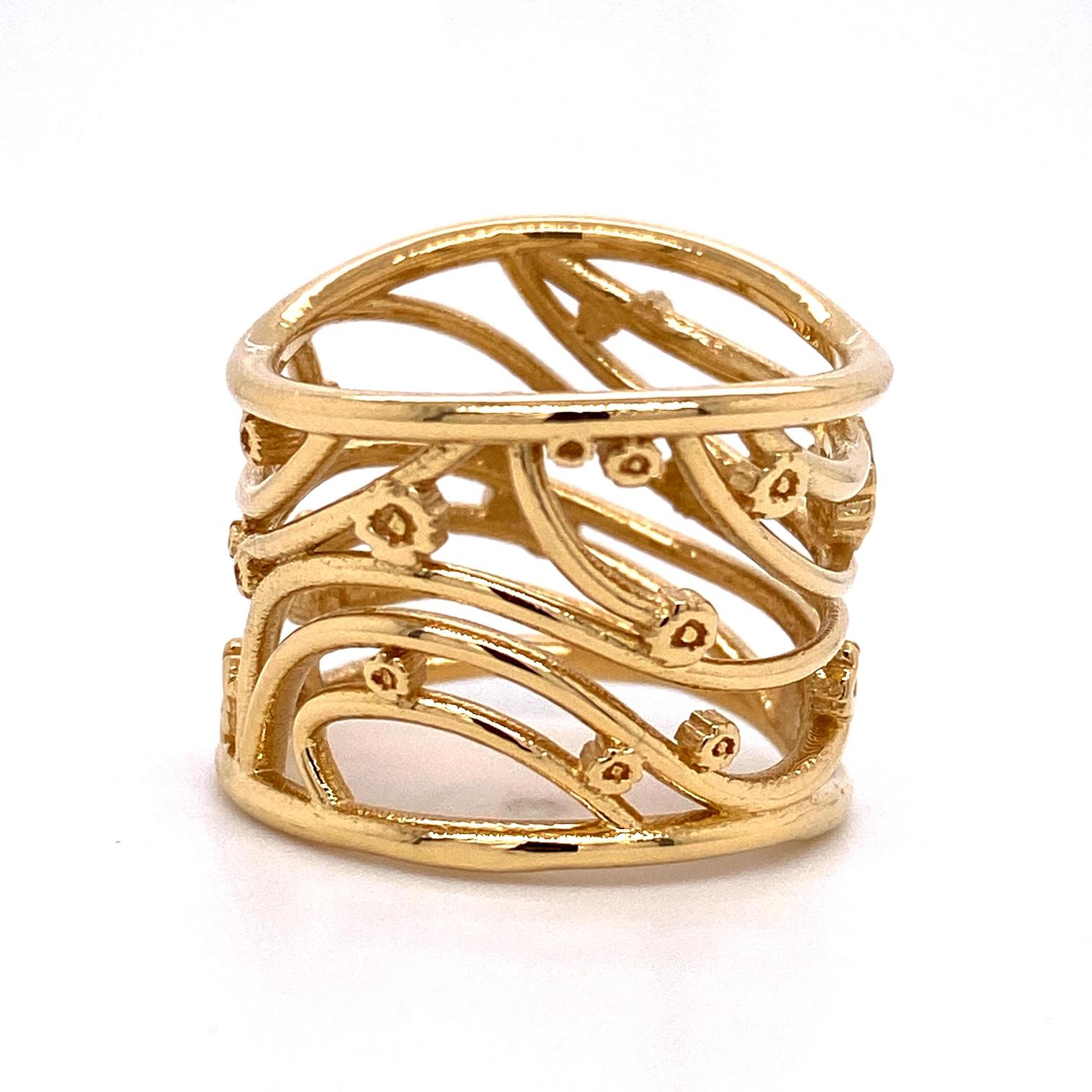 An 18k yellow gold wide ring inspired by the artwork of Gustav Klimt. Ring size 7. This ring was made and designed by llyn strong.