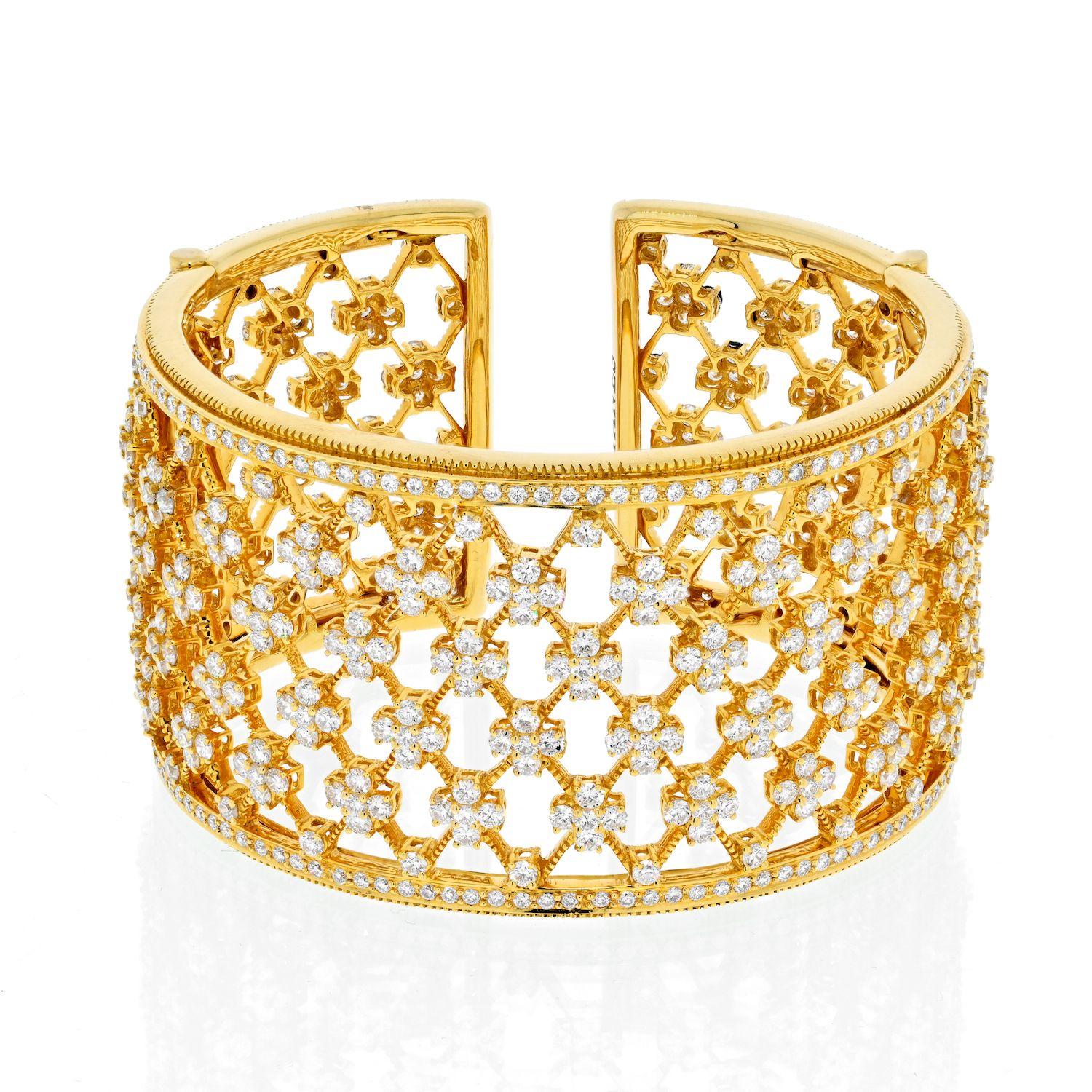 Elegant and feminine this a fabolous openwork diamond bangle crafted of 18K Yellow Gold.
Accented with round cut diamonds all around yet is appropriate to wear around town. This bangle is of a significant width, it measures 4cm wide and would fit