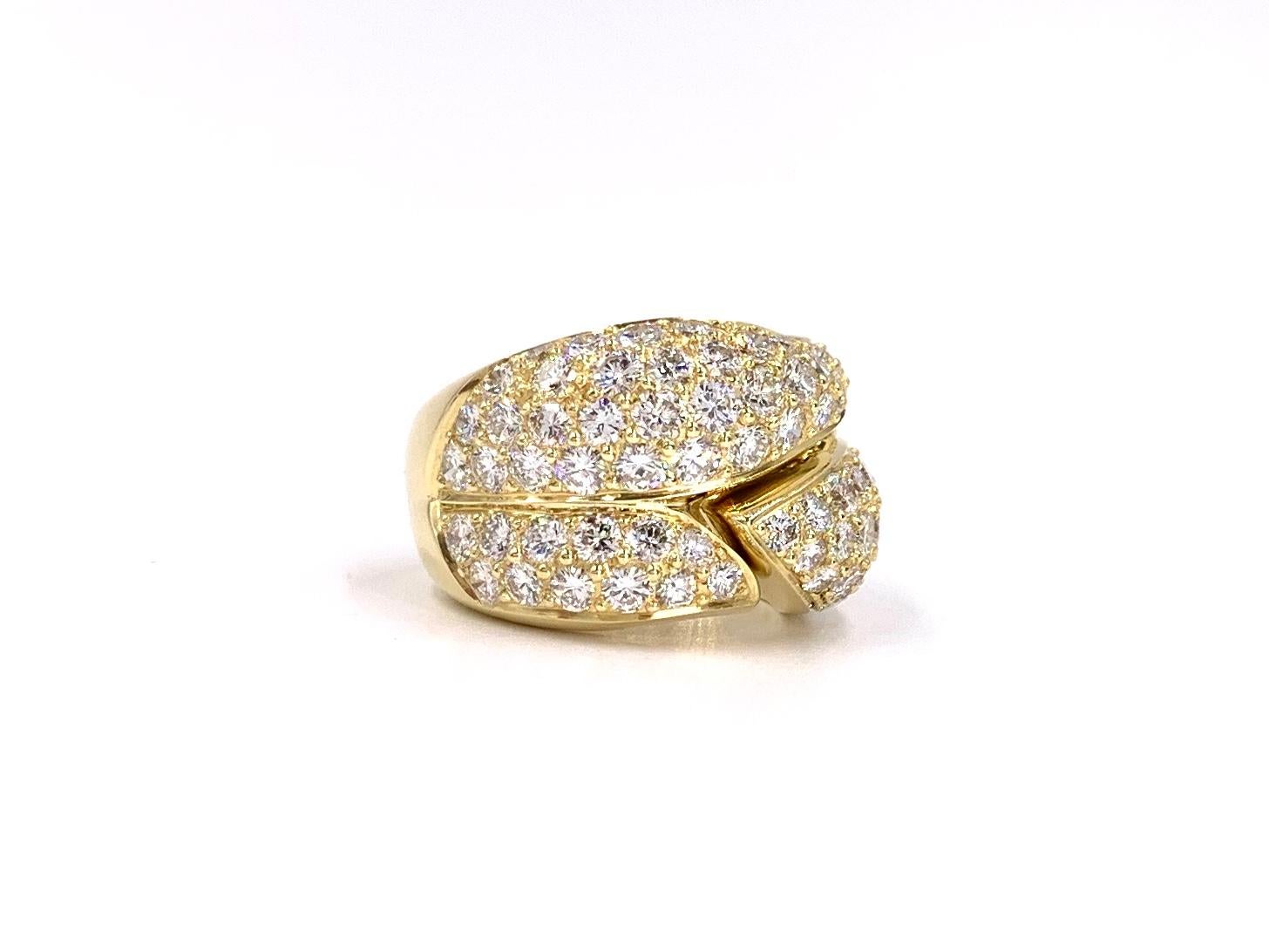 A unique 18k yellow gold wide curvy pavé diamond ring with a hinge feature allowing the ring to be taken on and off over fingers with knuckle issues and will fit a range of finger sizes comfortably. Ring is adorned with 84 high-quality round