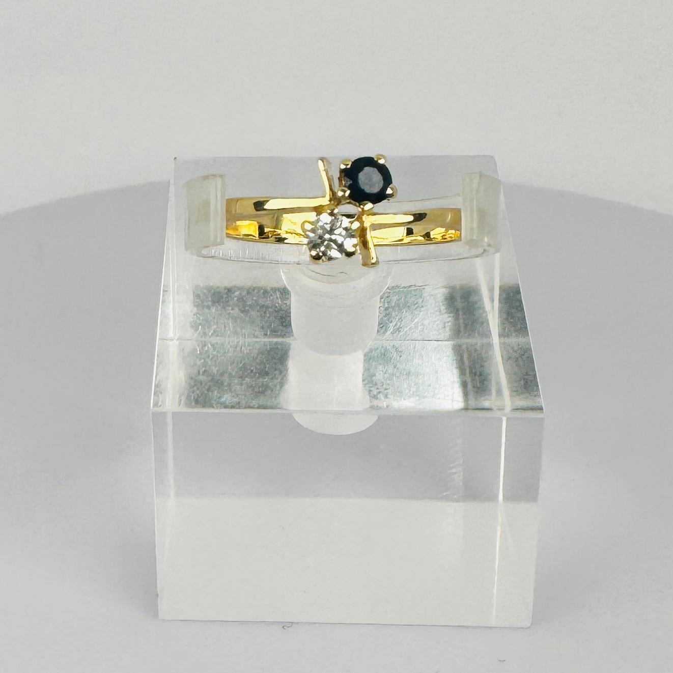 Women's 18k yellow gold with blue sapphire 0.06 ct with a brilliant-cut diamond 0.06 ct For Sale