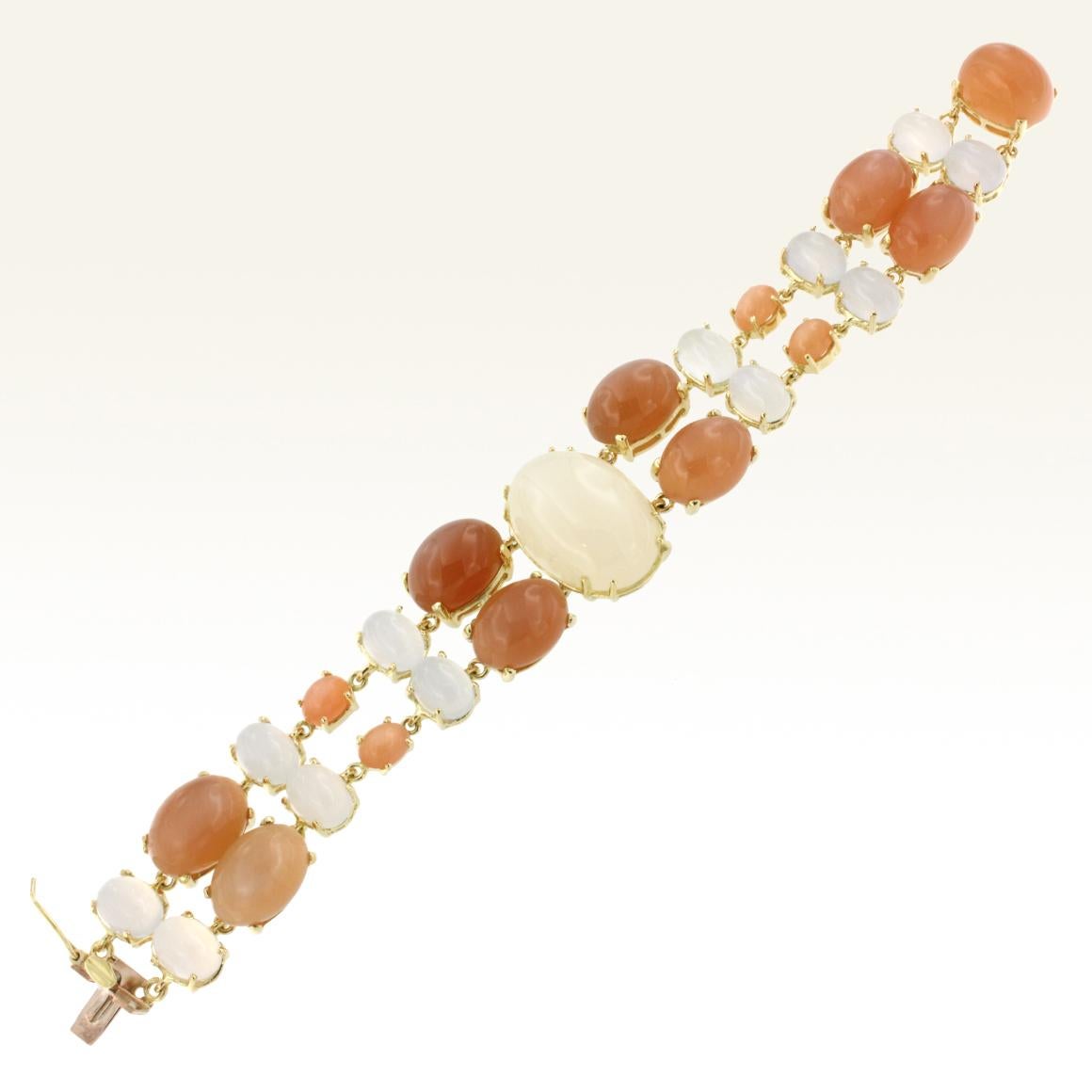 Modern Bracelet in 18 Karat yellow gold with White Moonstone (size: 16x23 mm), Peach Moonstone (size:  10x14 mm small 5x7) and Chalcedony mm 6x8 oval.  Total weight g.55.10
Very trendy and pretty  bracelet by Stanoppi Jewellery . The combination of