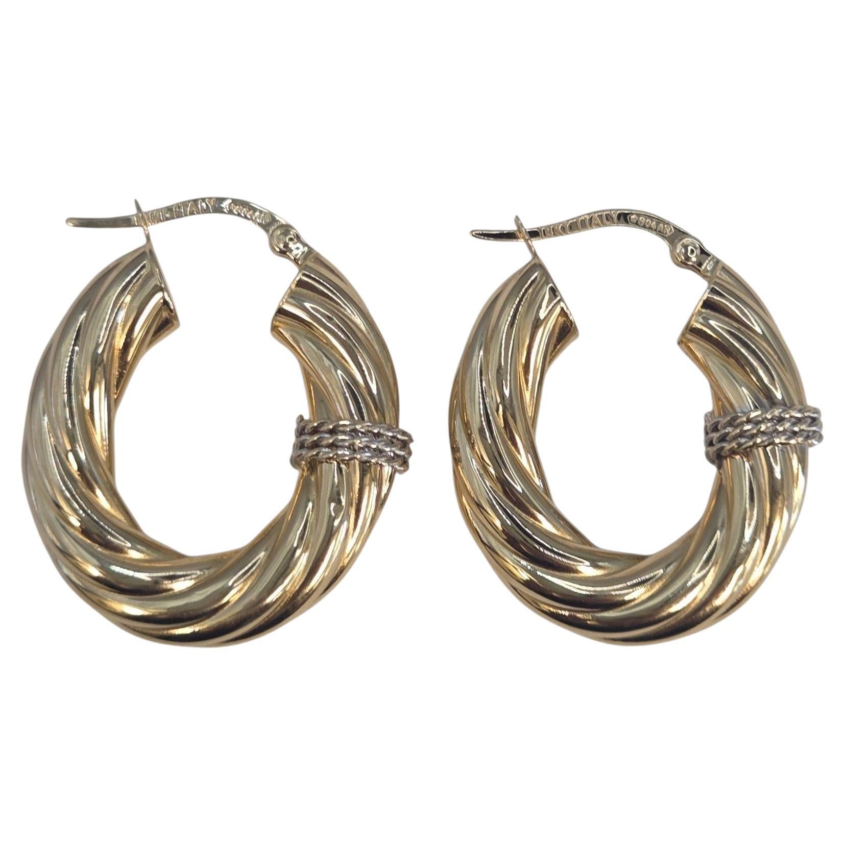 Orecchini a cerchio ovali ritorti in oro giallo 18K con accenti in oro bianco #23538