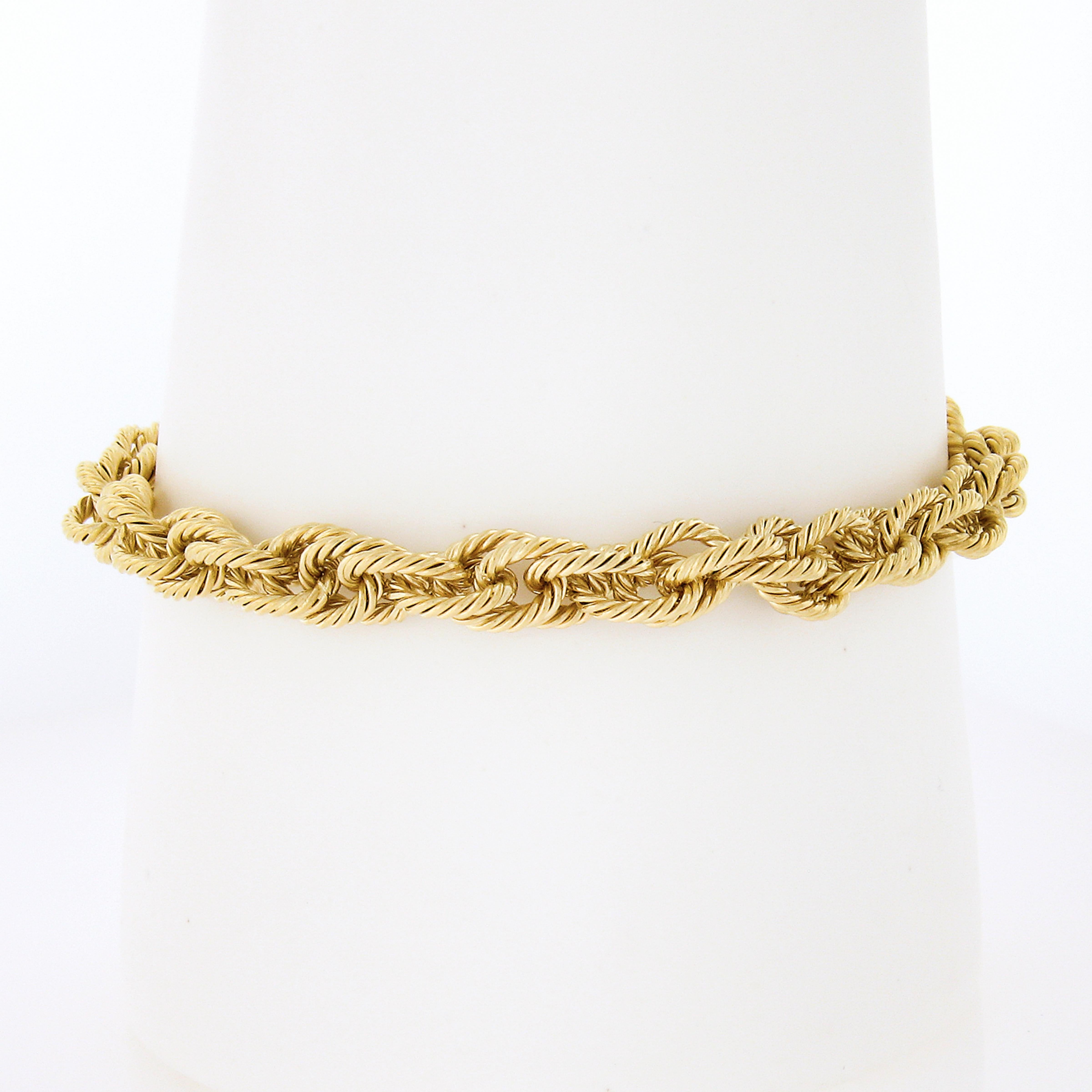 This gorgeous bracelet is crafted in solid 18k yellow gold and features woven textured twisted interlocking cable links. This bold bracelet features a large  oversized lobster claw clasp that ensures safe wear. Enjoy!

Material: Solid 18K Yellow
