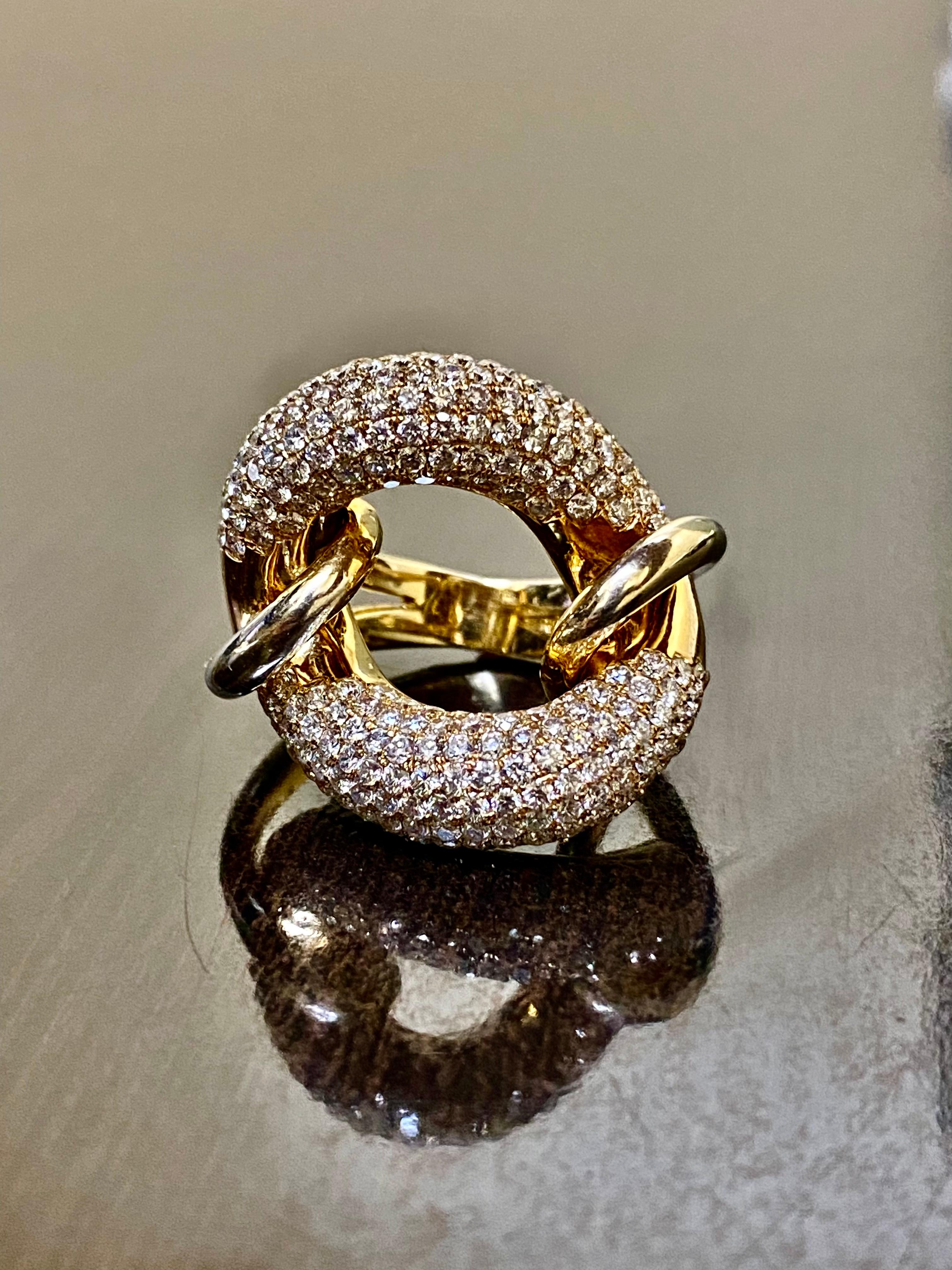 DeKara Designs Collection

Metal- 18K Yellow Gold, .750.  22 Grams

Stones- 256 Round Diamonds F-G Color VS1-VS2 Clarity, 6.14 Carats.

Feel like an aristocrat!

A one of a kind elegant and artistically crafted pave set seven row yin yang style
