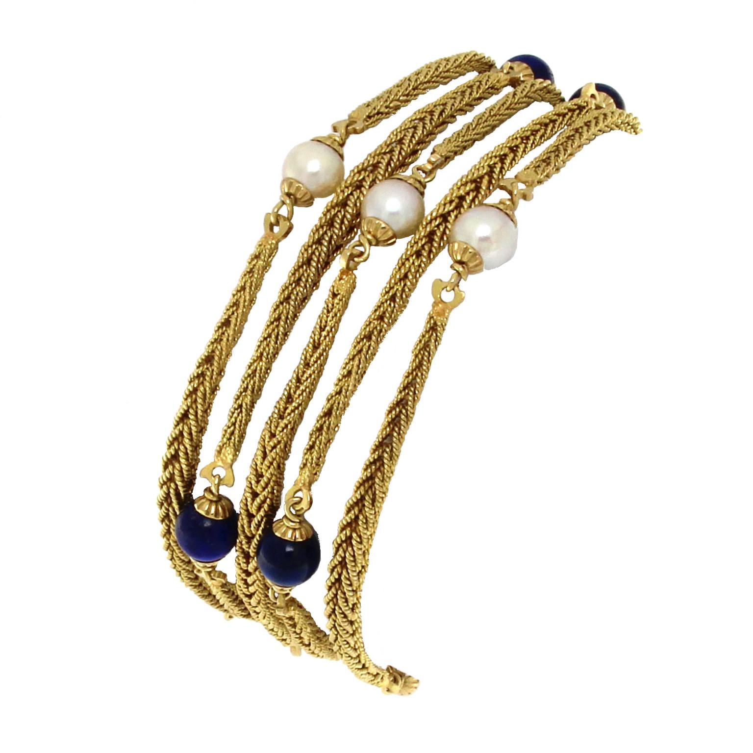 18k yellow multichain bracelet with pearls and lapis

Total weight of  gold 18 kt gr 41.00
6 pearls and 6 lapis beads
STAMP 750


