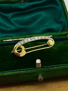 Spilla retrò italiana in oro giallo e bianco 18 carati e diamante da 0,30 carati (incastonato a grani)