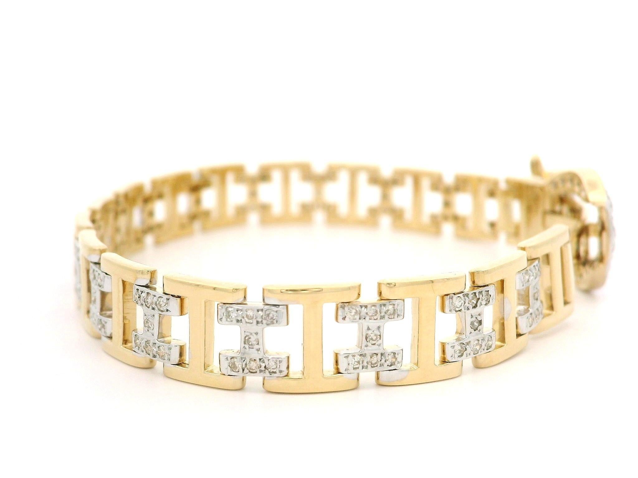 --A. Stone: --
129 diamanti naturali autentici - taglio rotondo brillante - incastonati - bel colore bianco brillante - 0,80ctw circa.

Materiale: Oro giallo massiccio 18 carati e accenti in oro bianco
Peso: 21.42 grammi
Tipo di catena: Bracciale a