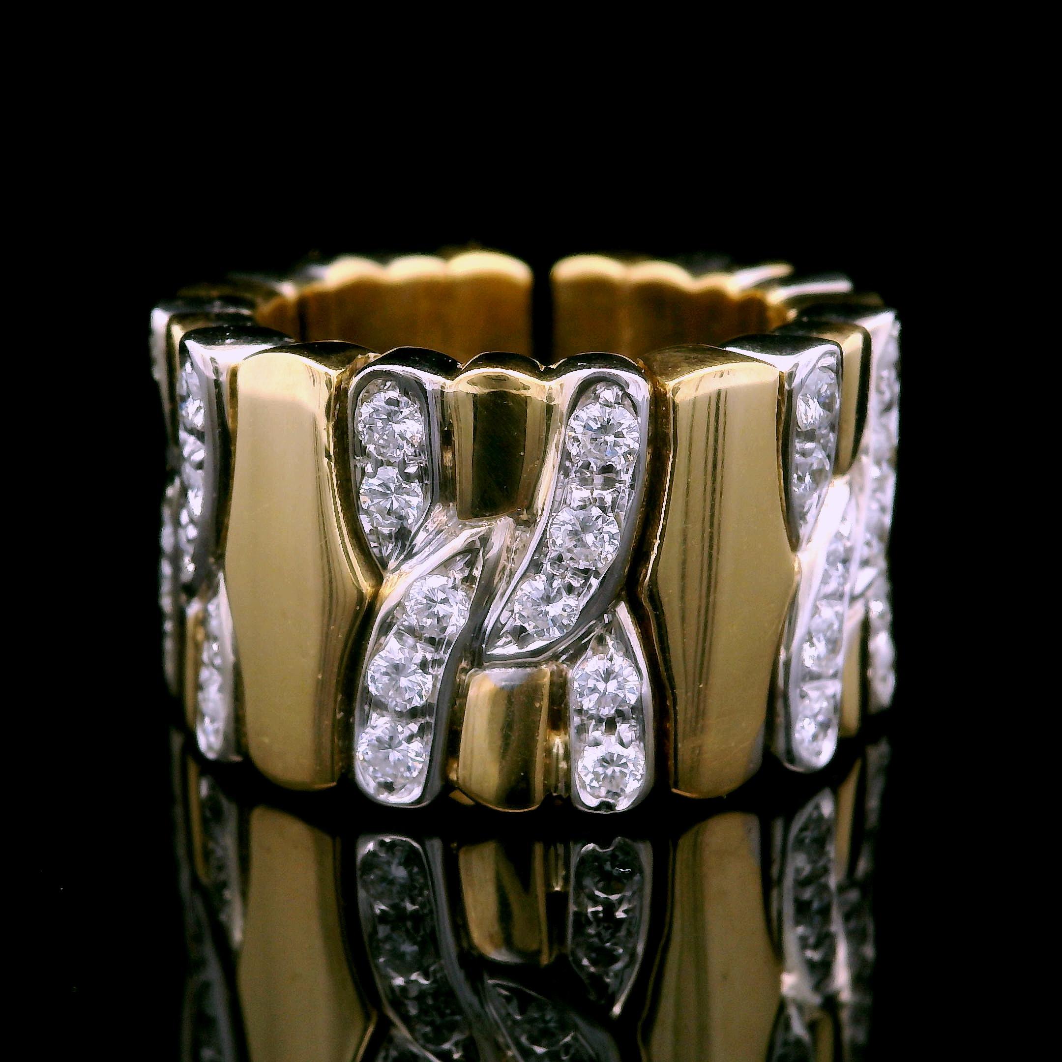---Stone(s):---
(50) Natural Genuine Diamonds - Round Brilliant Cut - Pave Set - VS1/VS2 Clarity - F/G Color
Total Carat Weight: 1.0 (approx.)

Material: Solid 18K Yellow & White Gold
Weight: 18.82 Grams
Ring Size: Fits Up to 6.0 Finger Size Due to