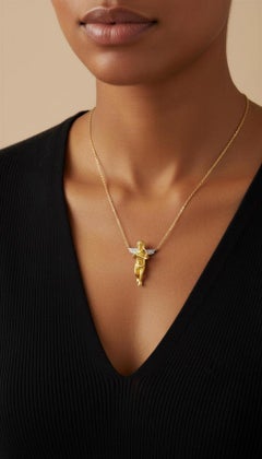 18K Yellow & White Gold Cherub with Diamond Wings holding a Lover's Bow & Arrow.