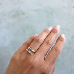 Anello bypass con diamante e freccia in oro giallo e bianco 18 carati