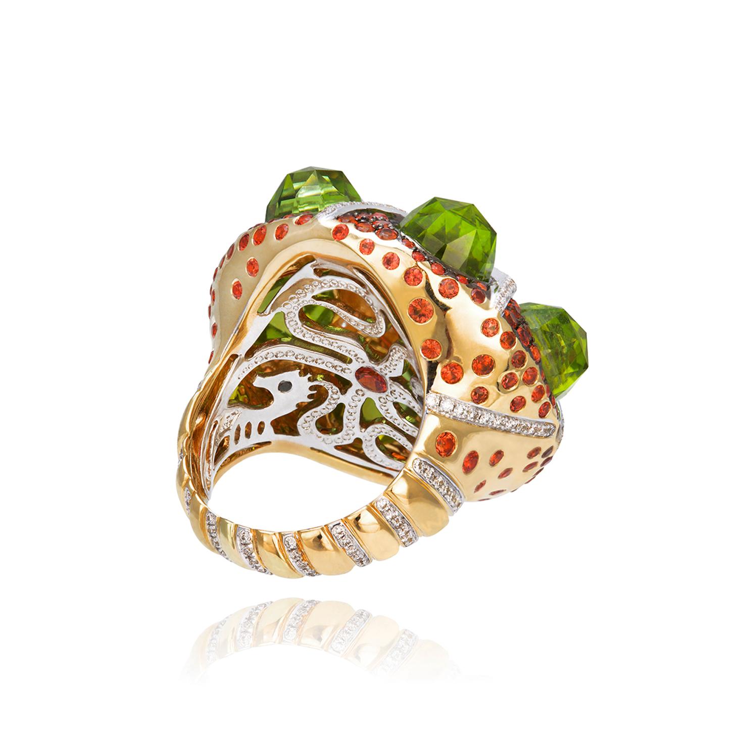 White and Black Diamonds 0.95 cts, Orange Sapphires 2.43 cts - Citrine Madeira round checkerboard cut 5.07 cts - Peridots briolette bullett 6 pcs 19.68 cts     
         
Ophiura Ring from Thalassa Collection, features a starfish moving between