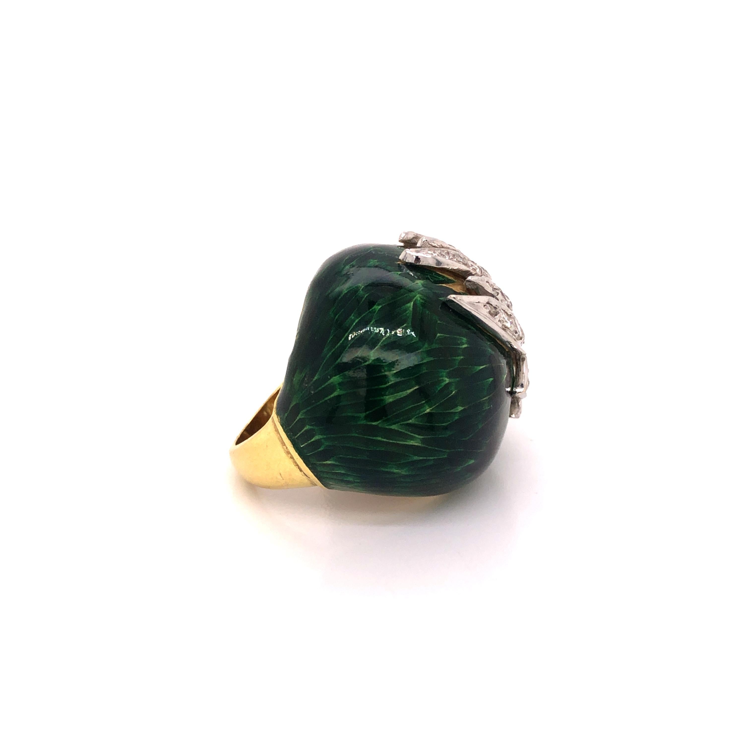A stunning vintage cocktail ring featuring full-cut diamonds weighing a total of approximately 0.90 carat, set in 18k white gold, enhanced by green enamel finish.

Ring size 6.5
