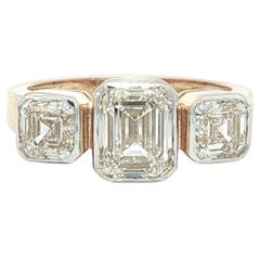 18k Yellow & White Gold GIA 2.60ctw Emerald Cut Bezel Set Diamond 3 Stone Ring