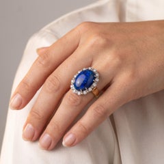 18k Yellow/White Gold Oval Cut Center Opal and Diamond Halo Ring